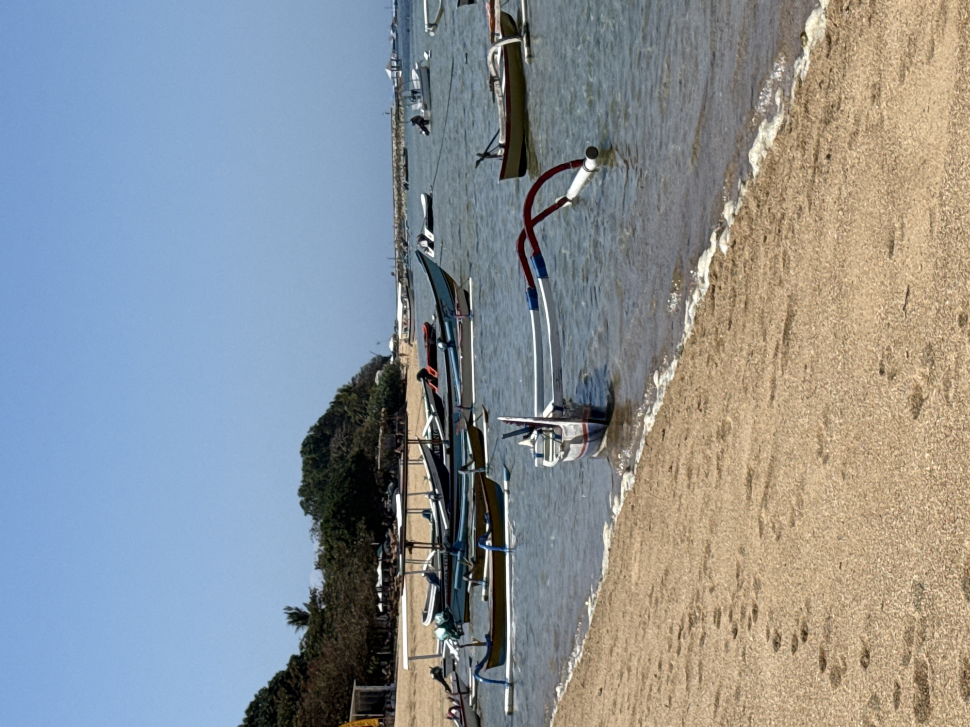 Calm morning swim and selfies at a Denpasar beach.