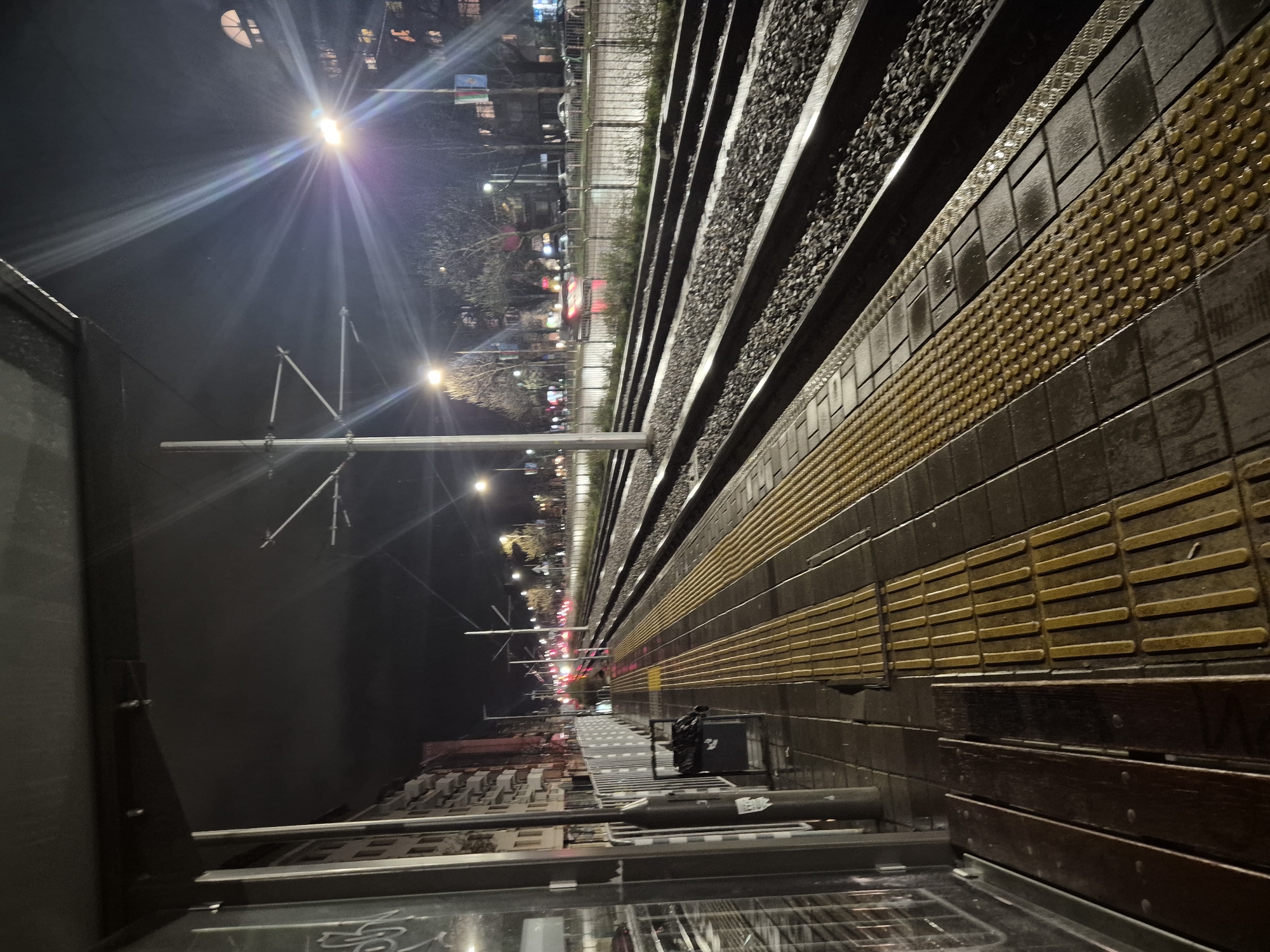 Nighttime train platform scene captured in Sofia, Bulgaria