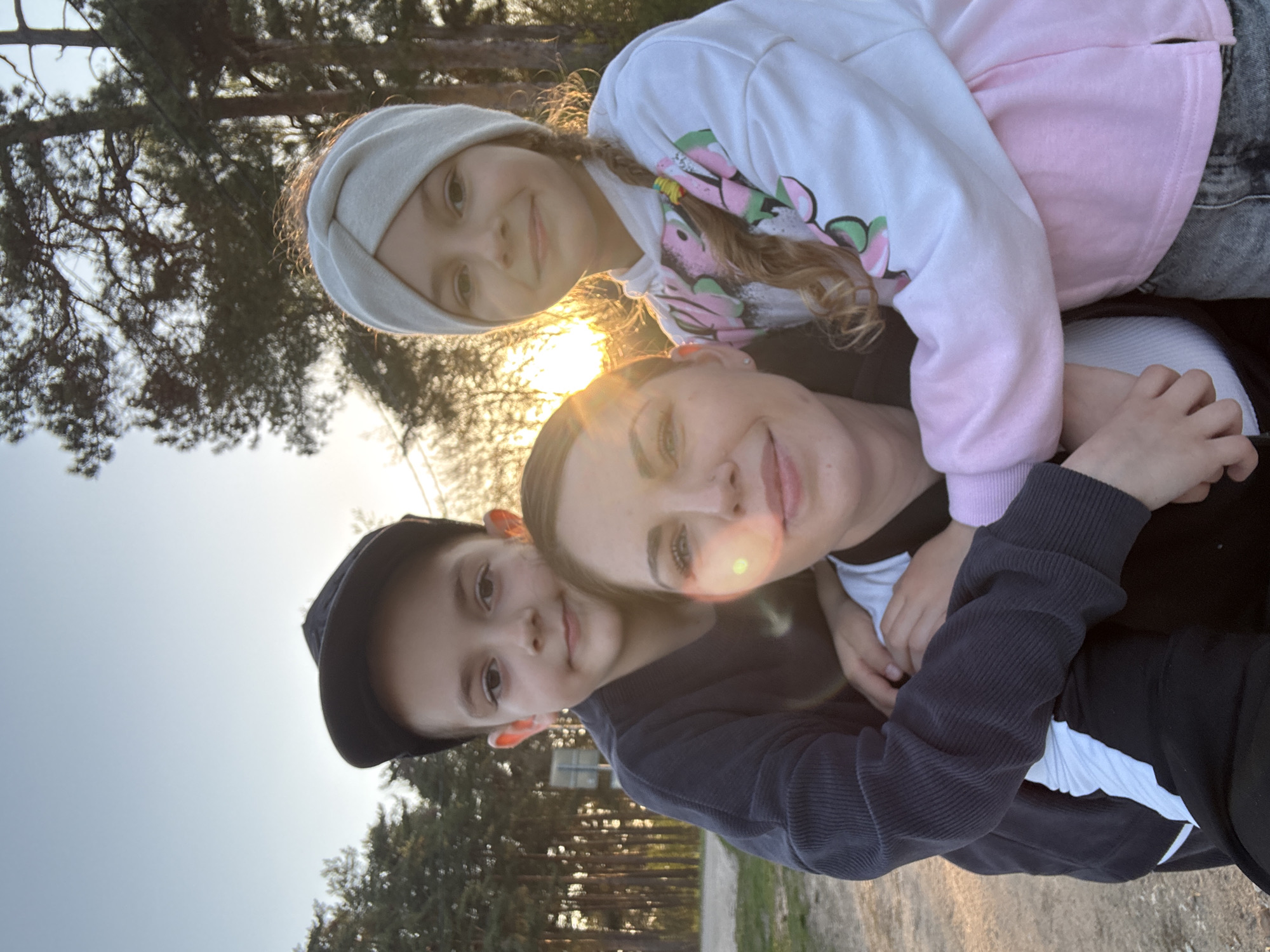 Family enjoys afternoon playground visit in Раздолье, Russia