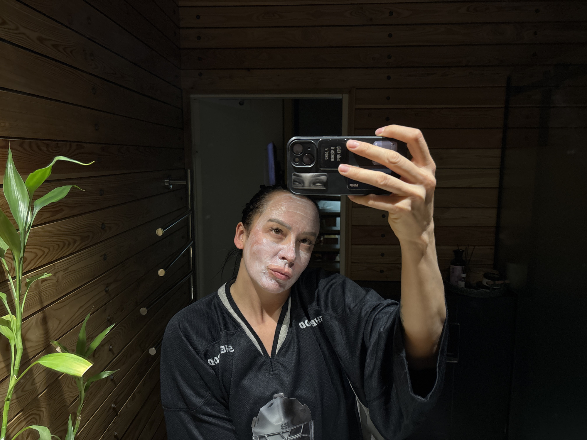 Woman documents skincare routine with pet dog in Russia