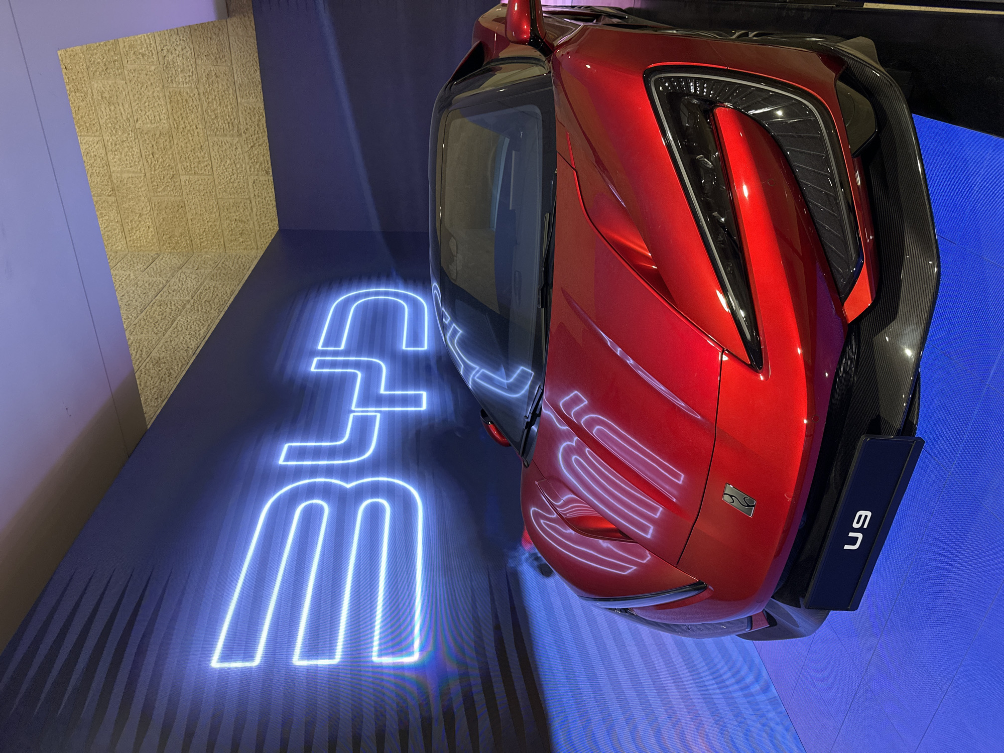 Red sports car on display in Tel Aviv showroom