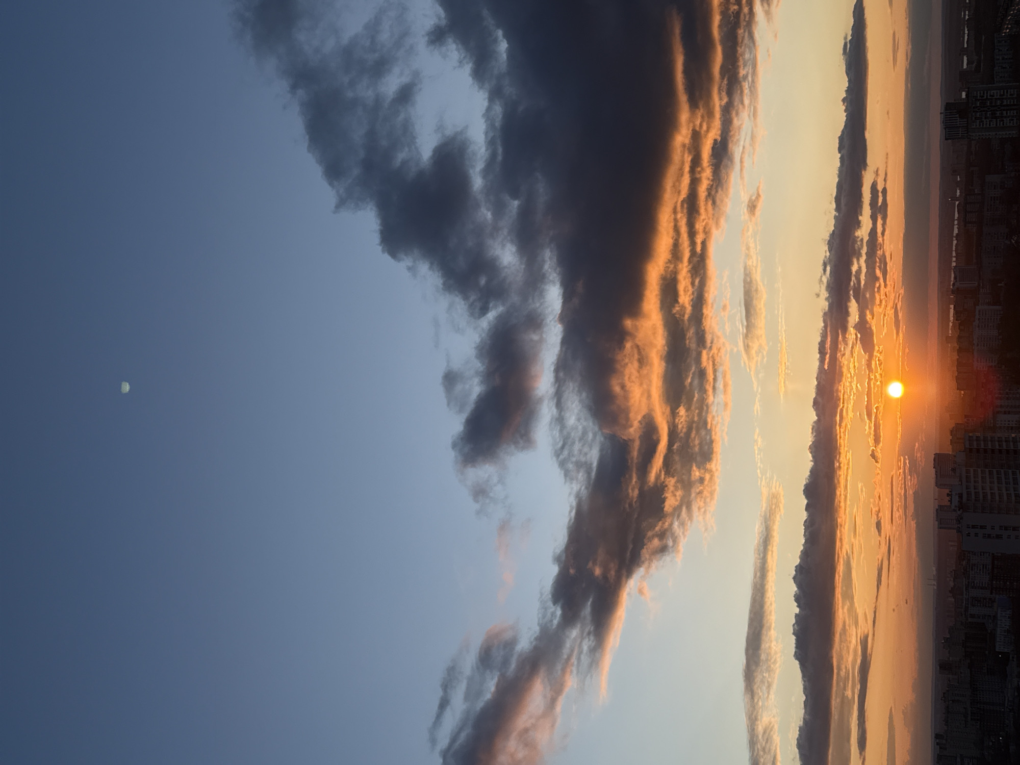 Dramatic sunset displays golden hues over Perm, Russia