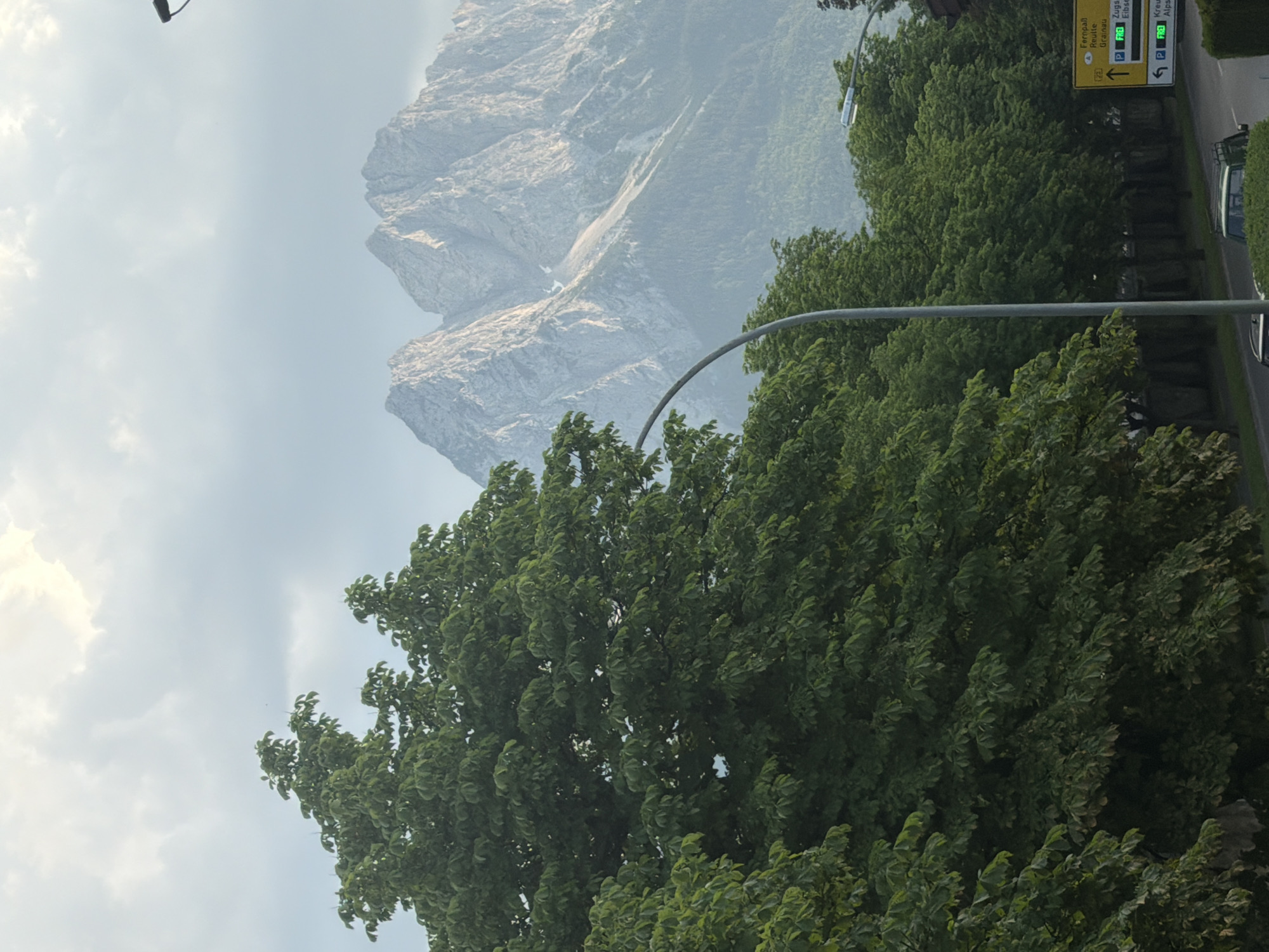 Rocky alpine peaks rise behind a European town's streets