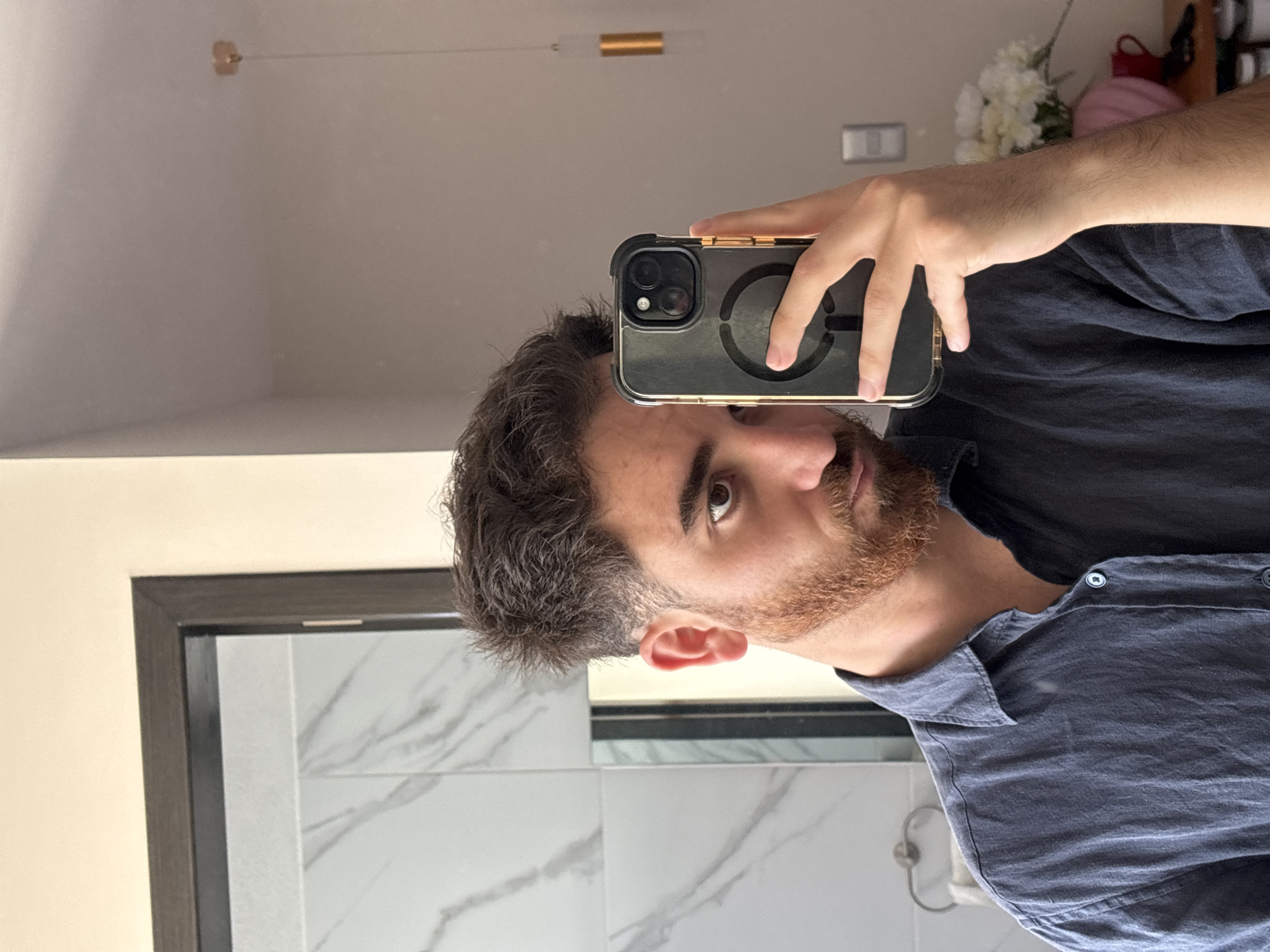 Man takes mirror selfie in Santa Clara Ocoyucan indoor location