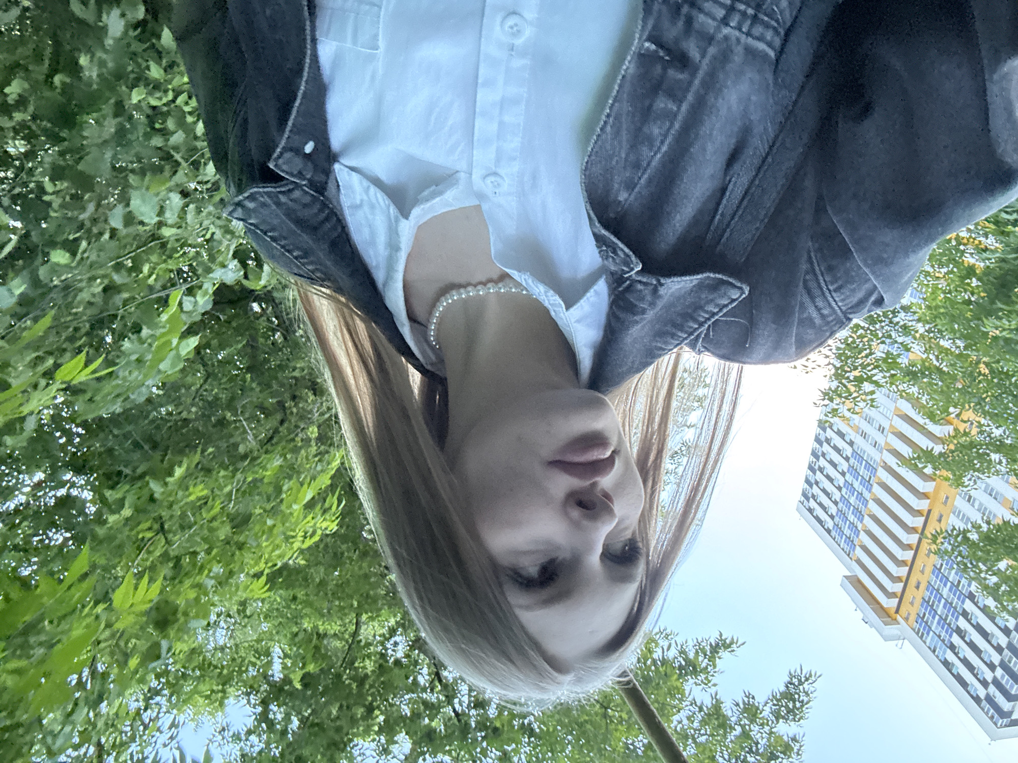 Young woman takes selfies during photo session in Perm