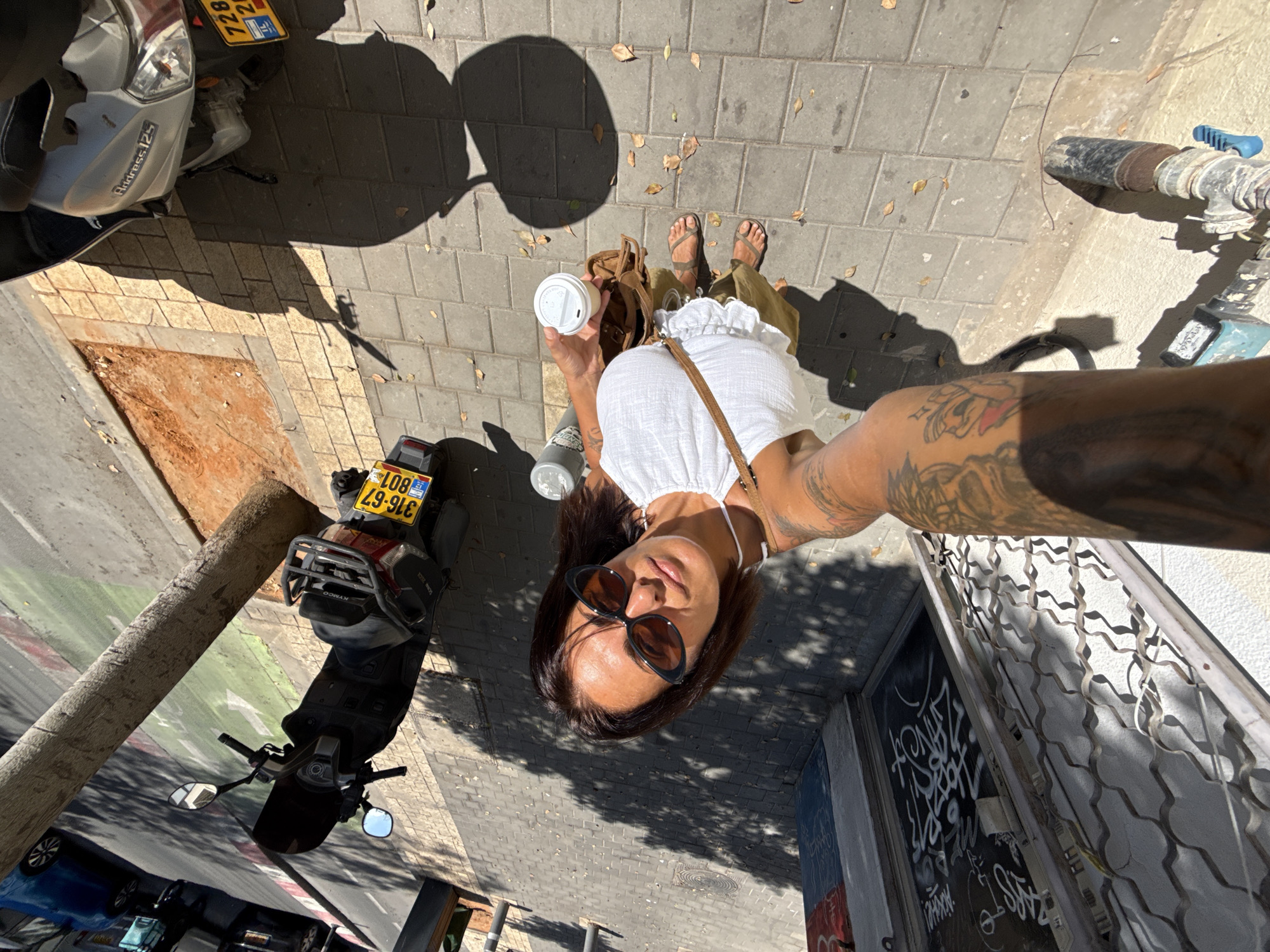 Morning coffee stop on a Tel Aviv sidewalk
