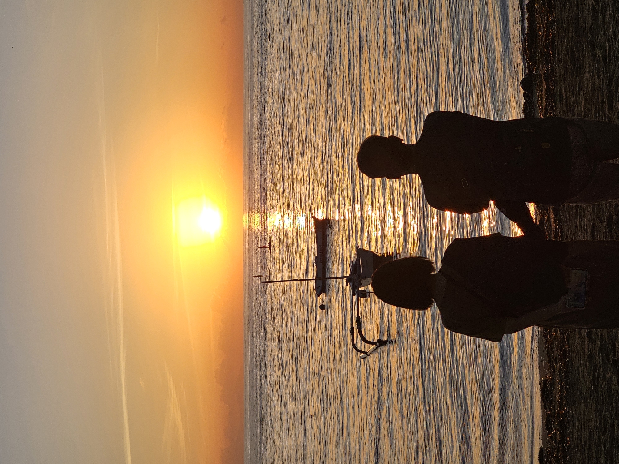Sunset photography and traditional boats captured at Denpasar beach