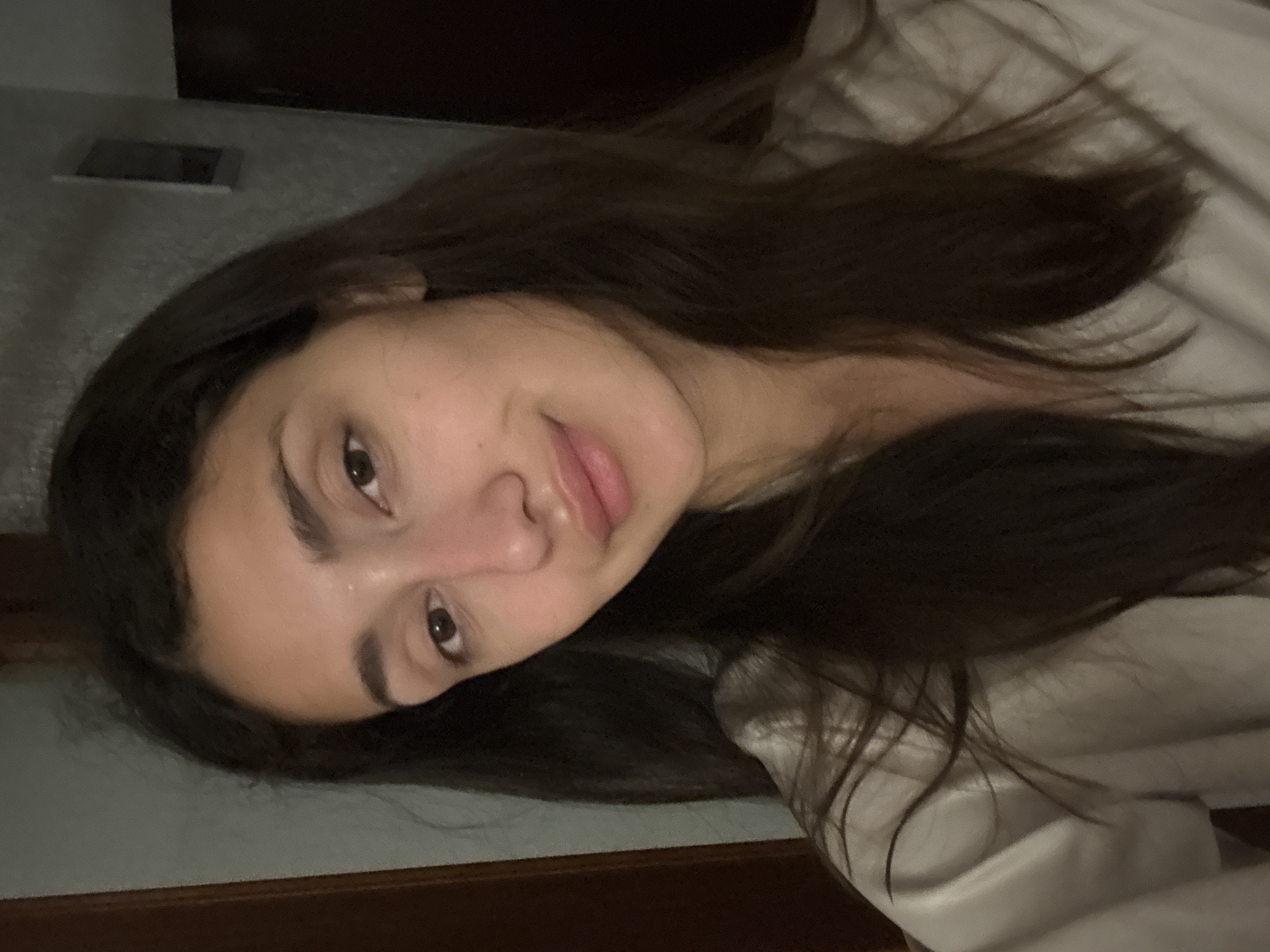 Woman documents evening skincare routine in Sutomore bathroom