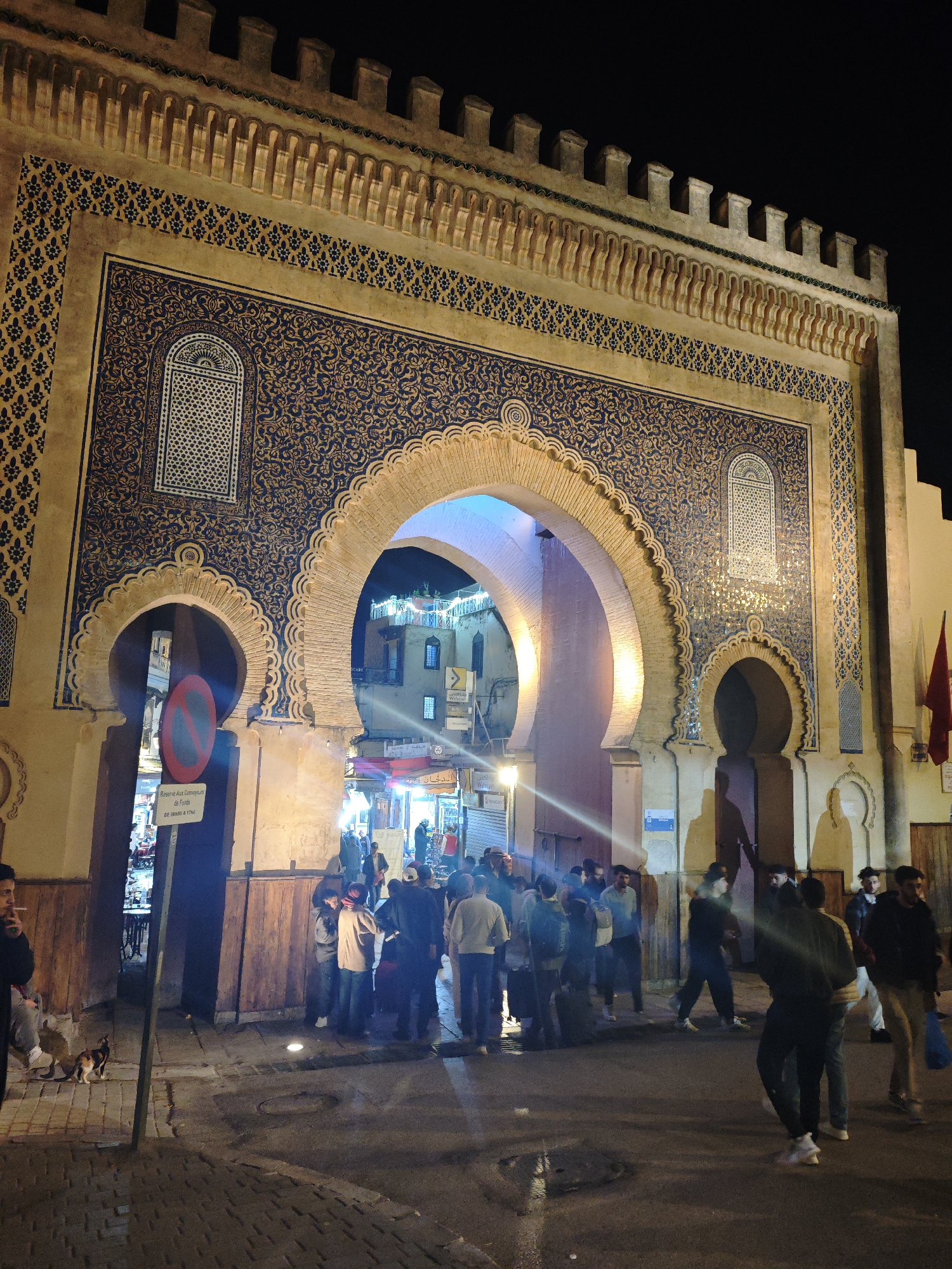 Historic Blue Gate illuminated at night in Fez Morocco