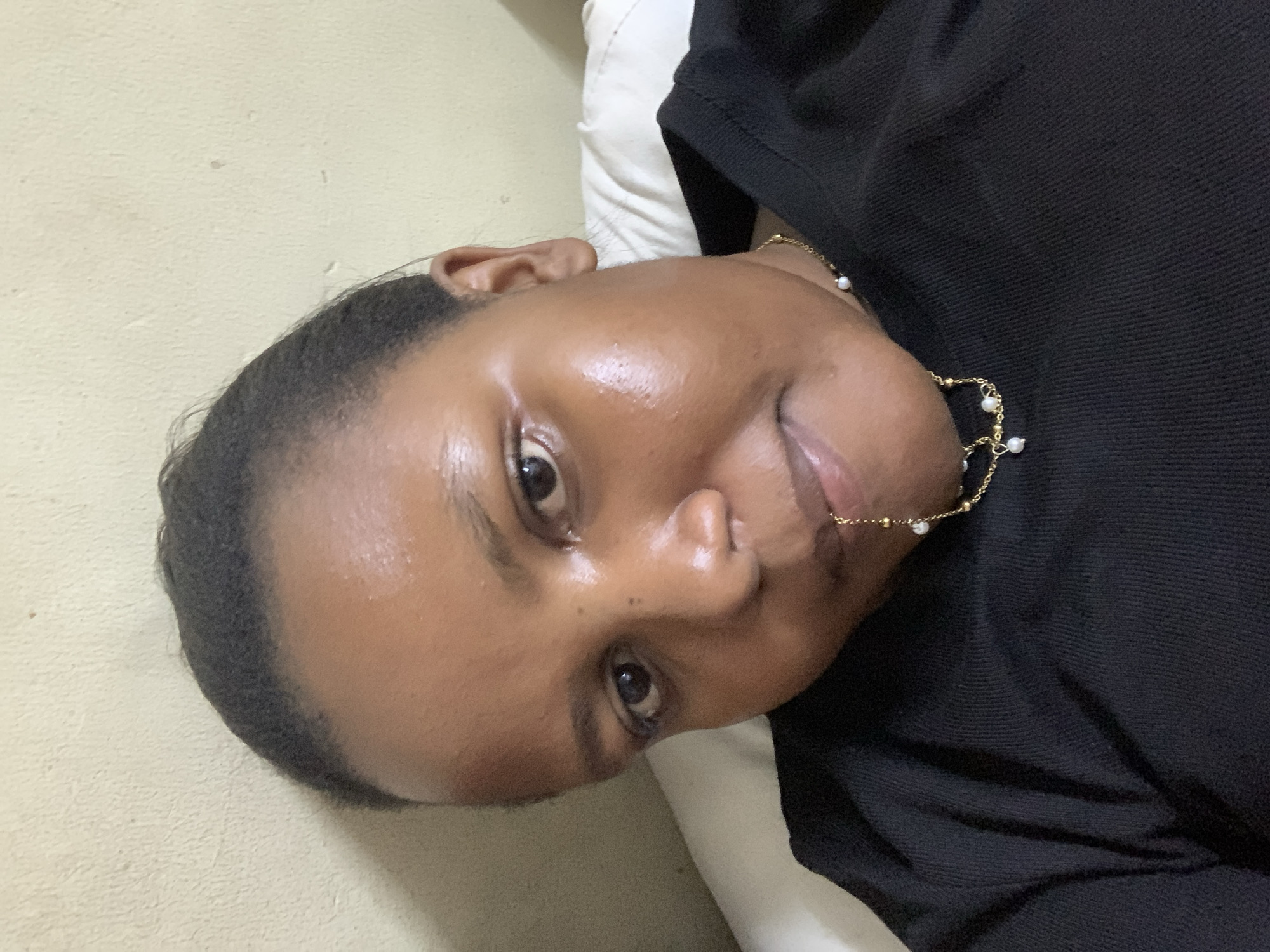 Woman photographed in casual indoor moments in Dar es Salaam