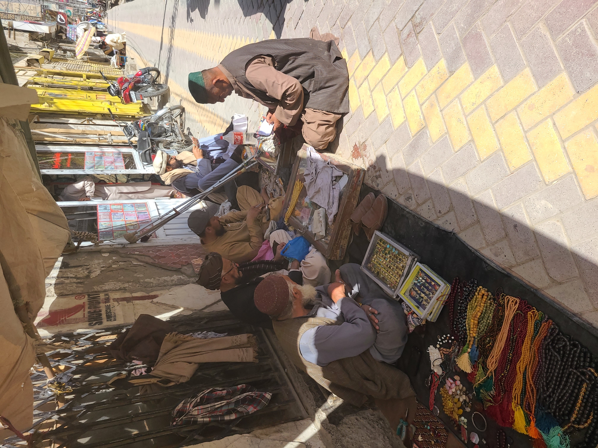 Street vendors conduct morning business in Quetta sidewalks