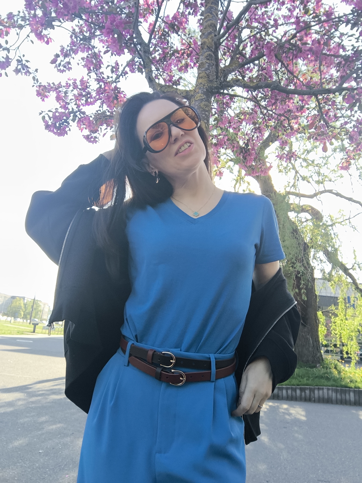 Woman poses for photos amid spring blooms in Riga