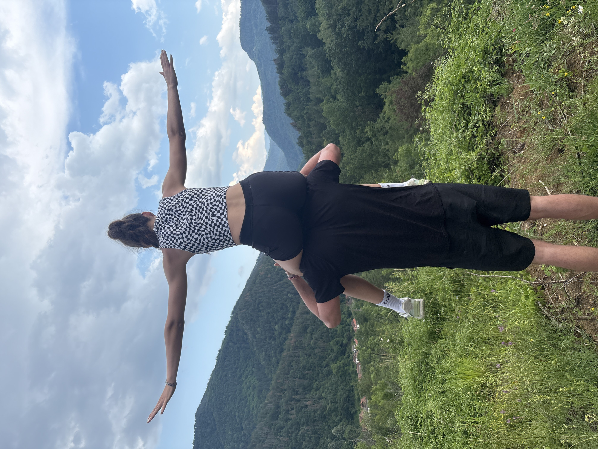 Hikers explore mountainous terrain with valley views June 6