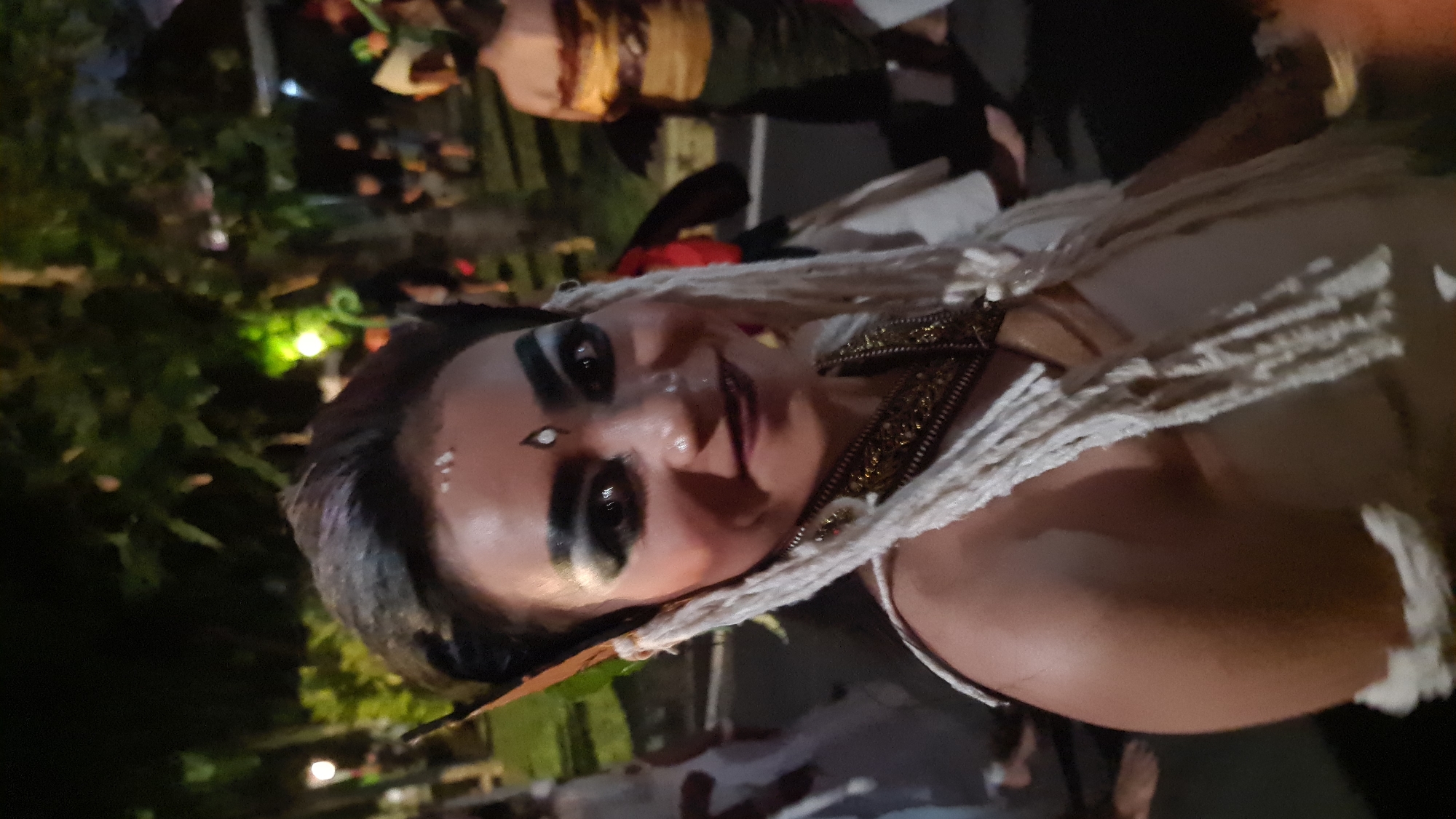 Elaborate Balinese performance costume and makeup, Denpasar