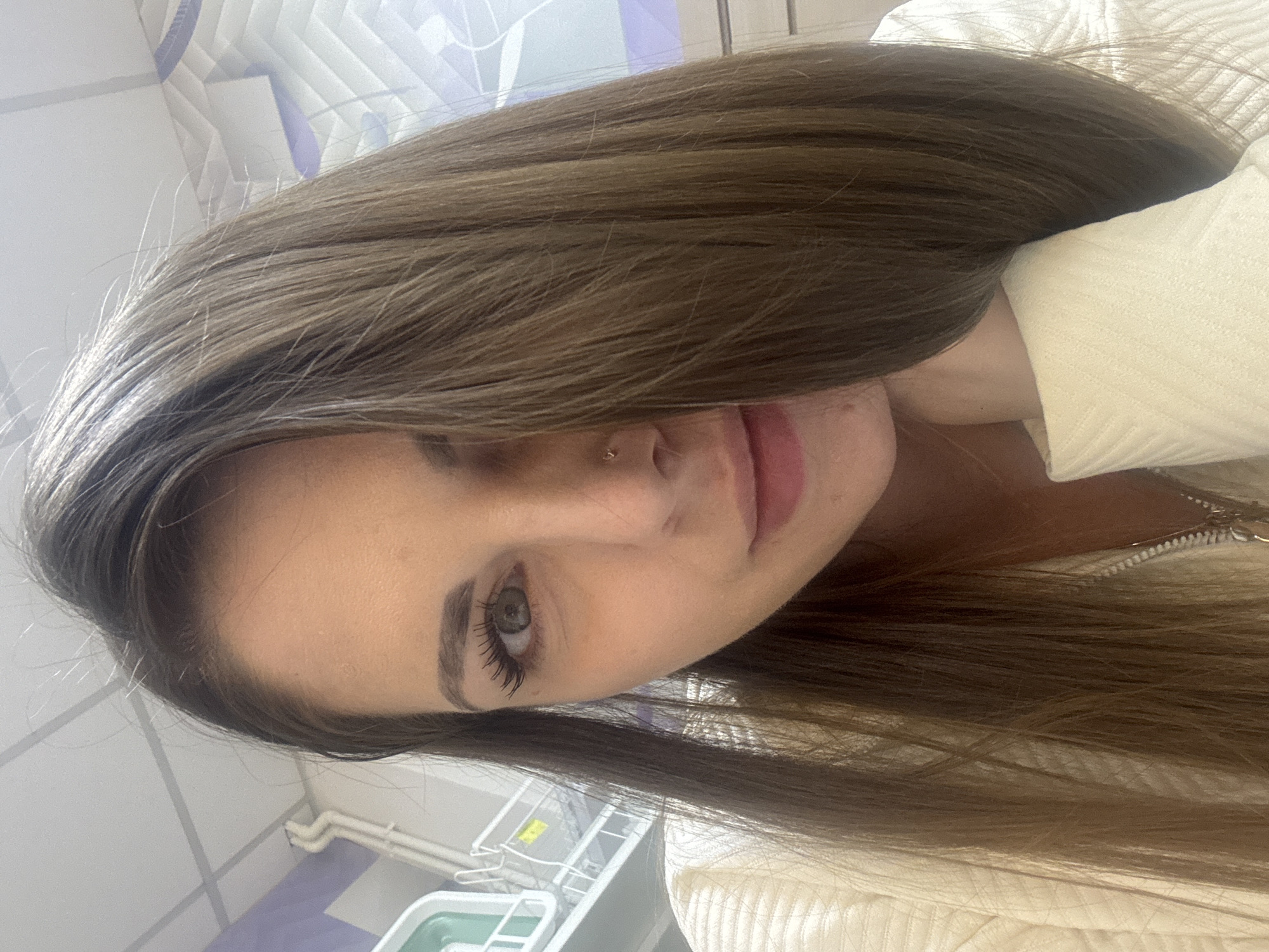Woman documents shopping trip with selfies in Klin store