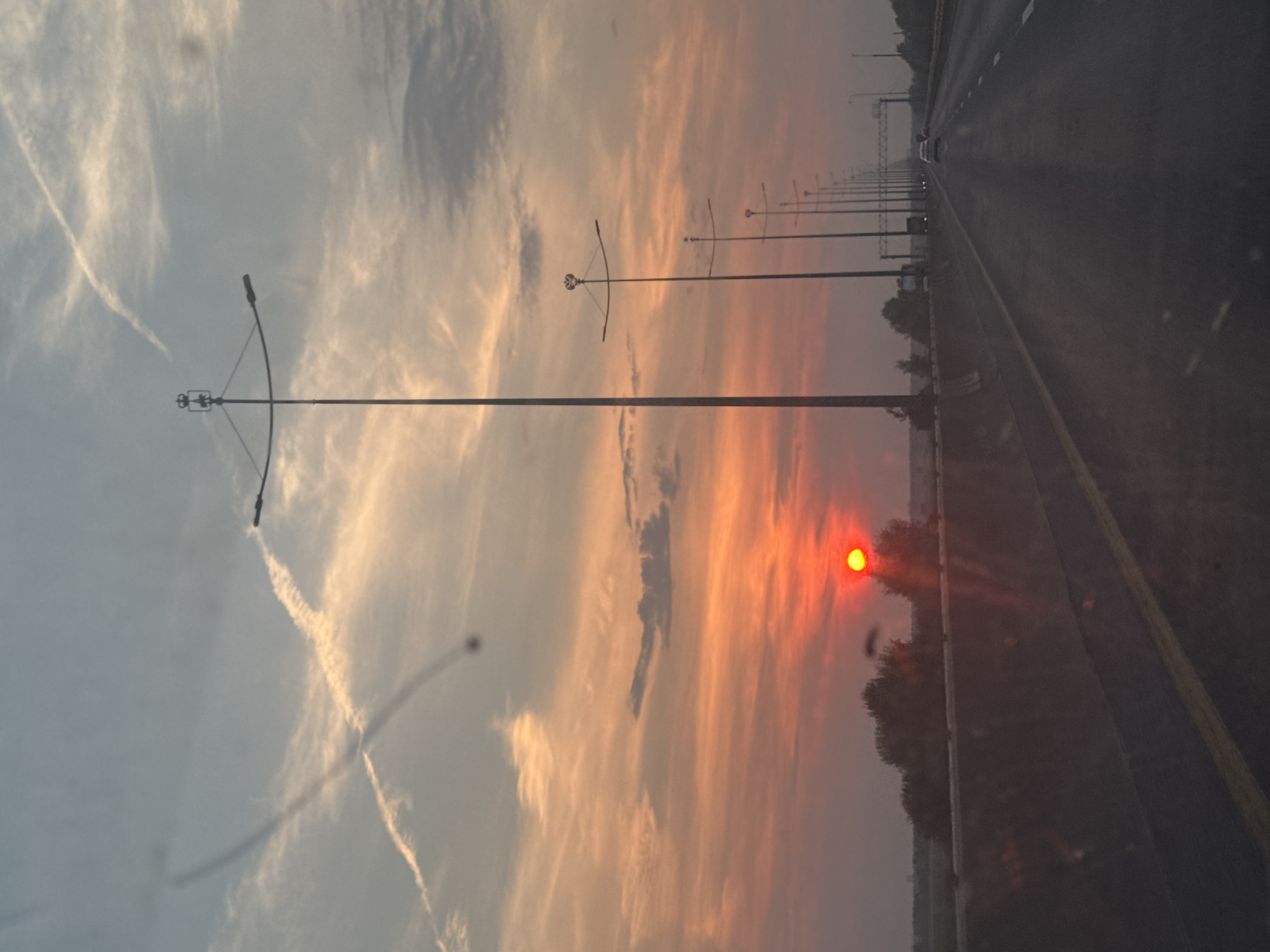 Red summer sunset over a Perm highway, July evening