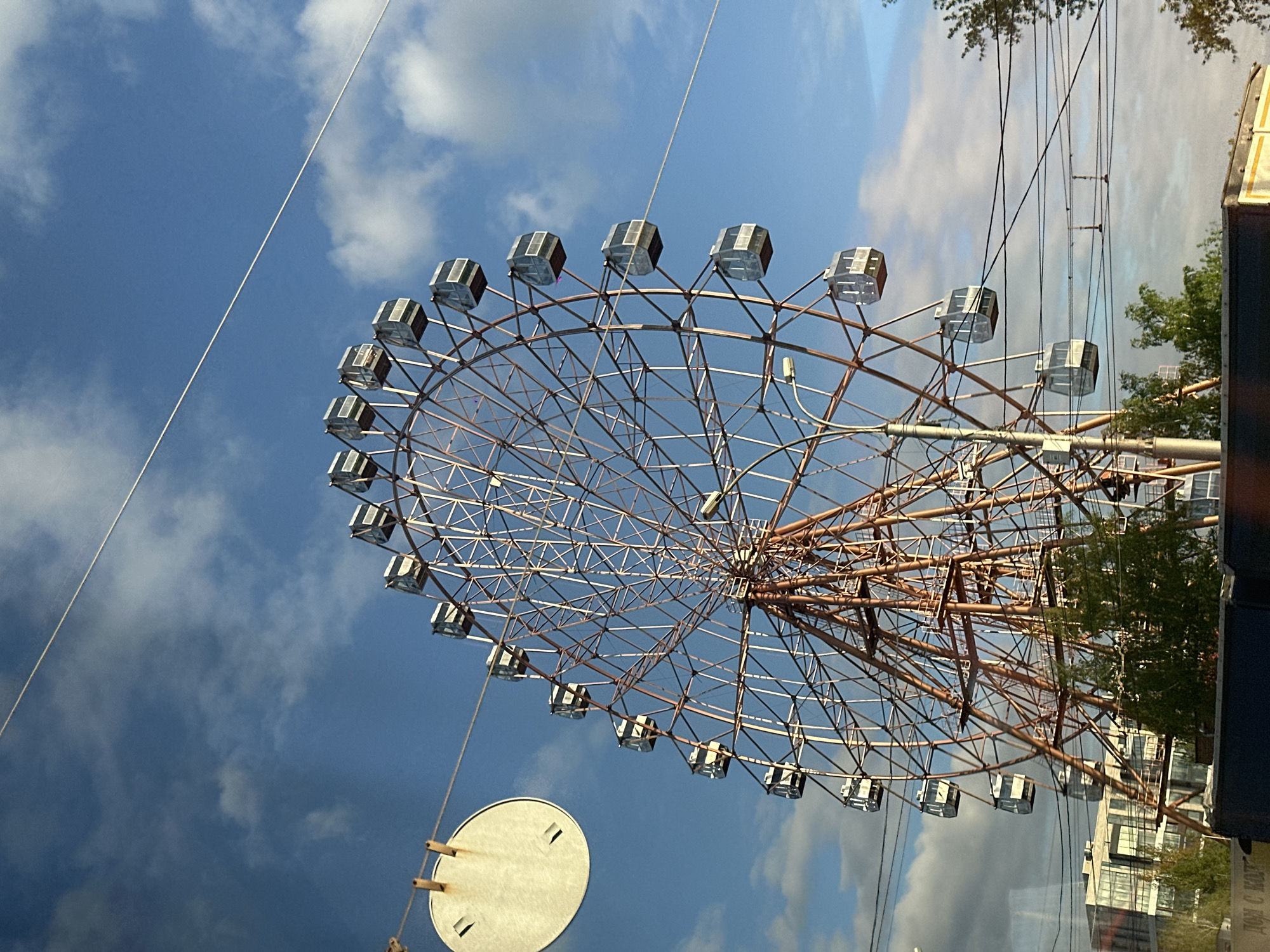Ferris wheel observed operating in Novosibirsk under blue skies