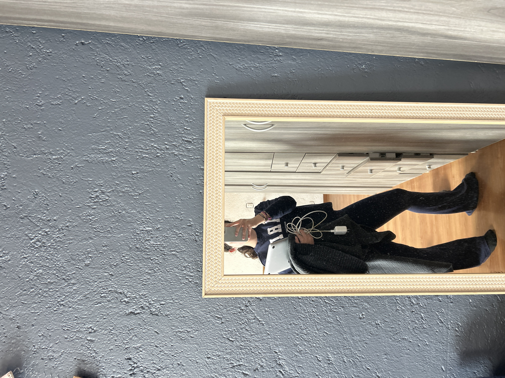 Person Takes Rotated Mirror Selfie Indoors