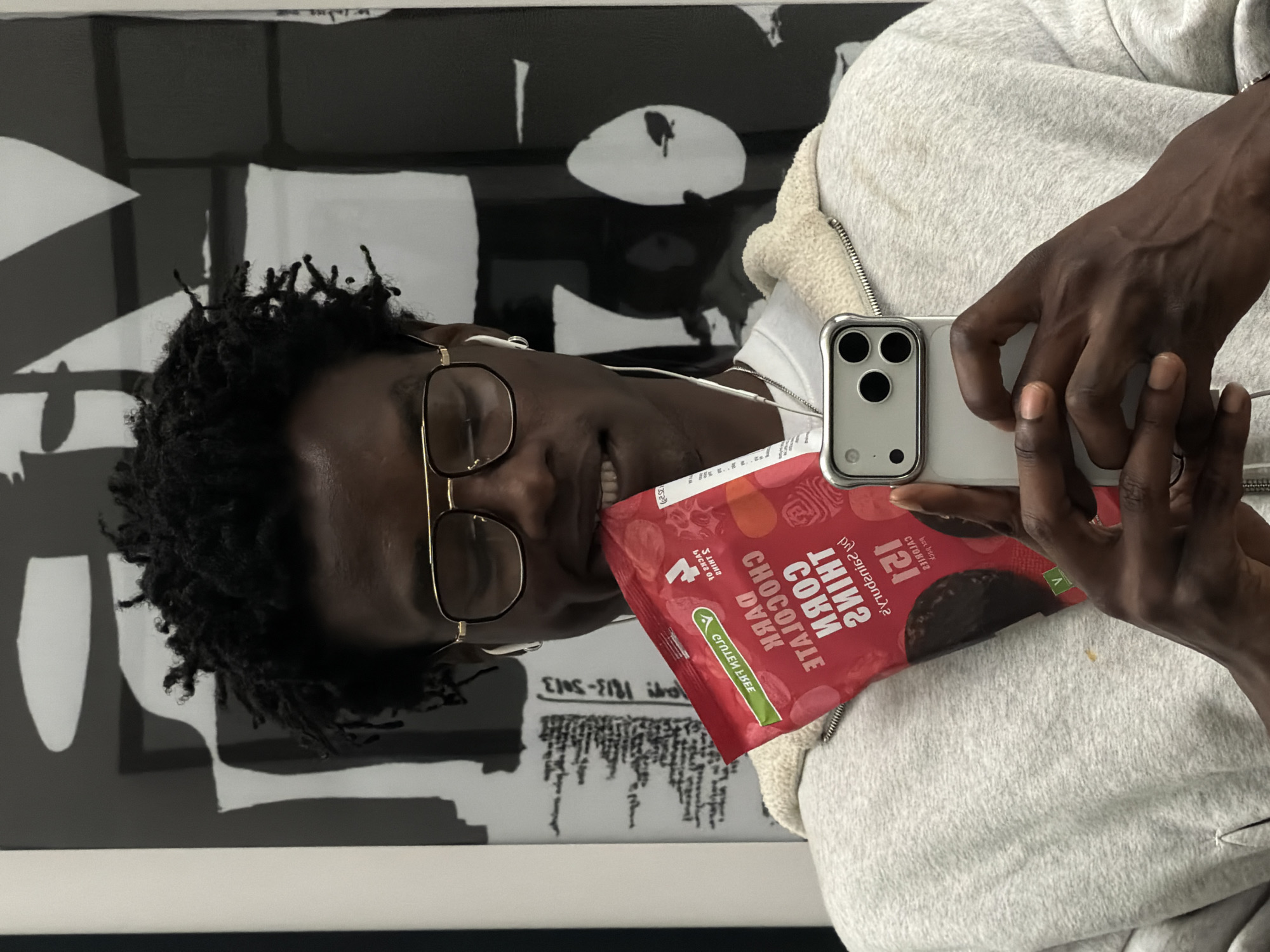 Two young people take selfies in London indoor locations