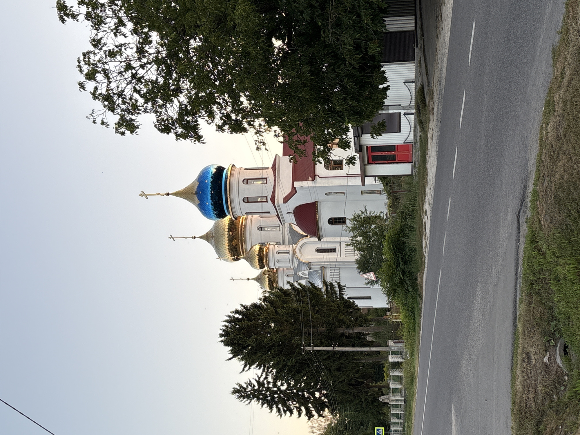 Evening streets and Orthodox church in Lanivtsi, Ukraine