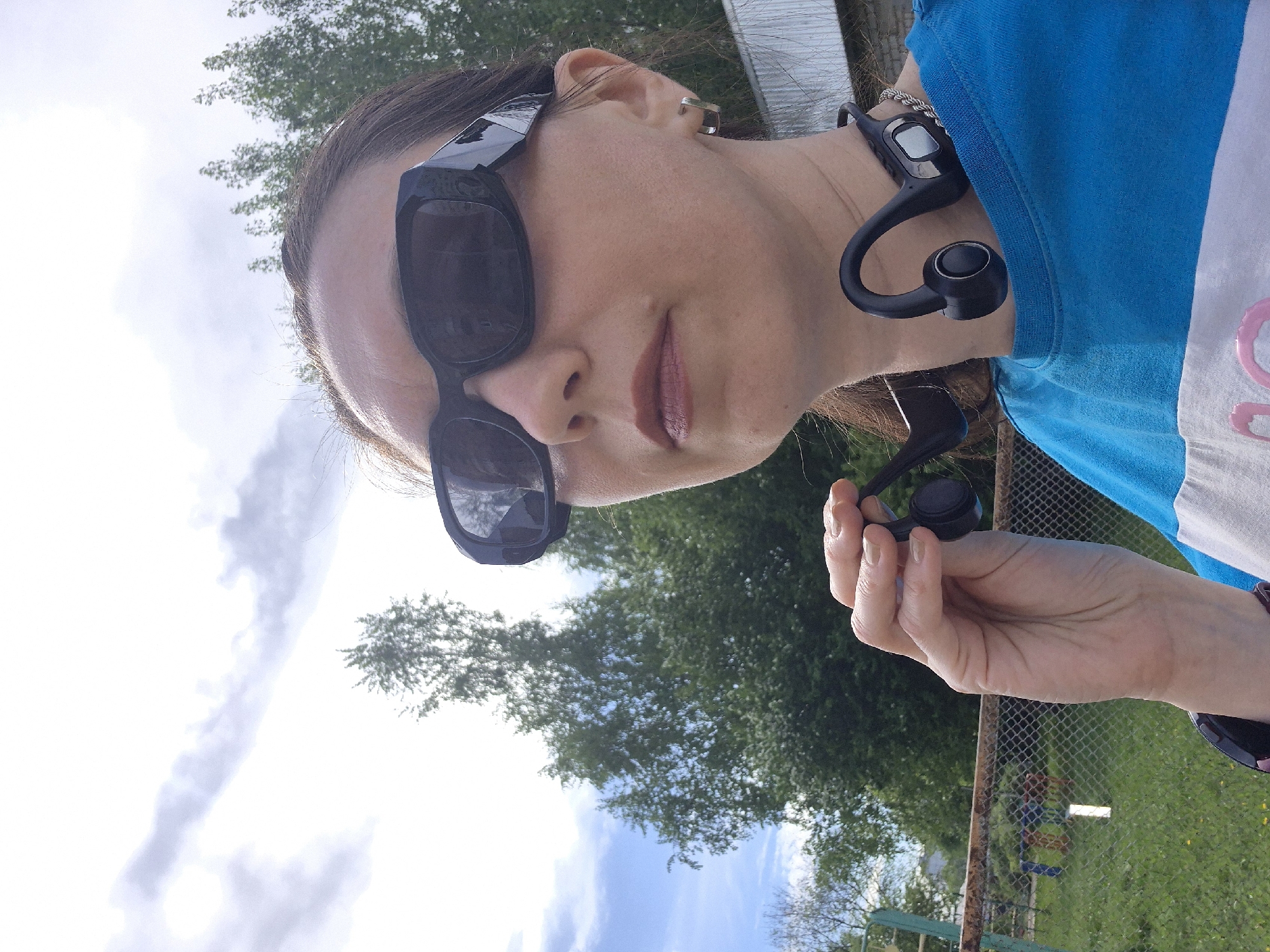Woman with headphones spotted in urban outdoor setting