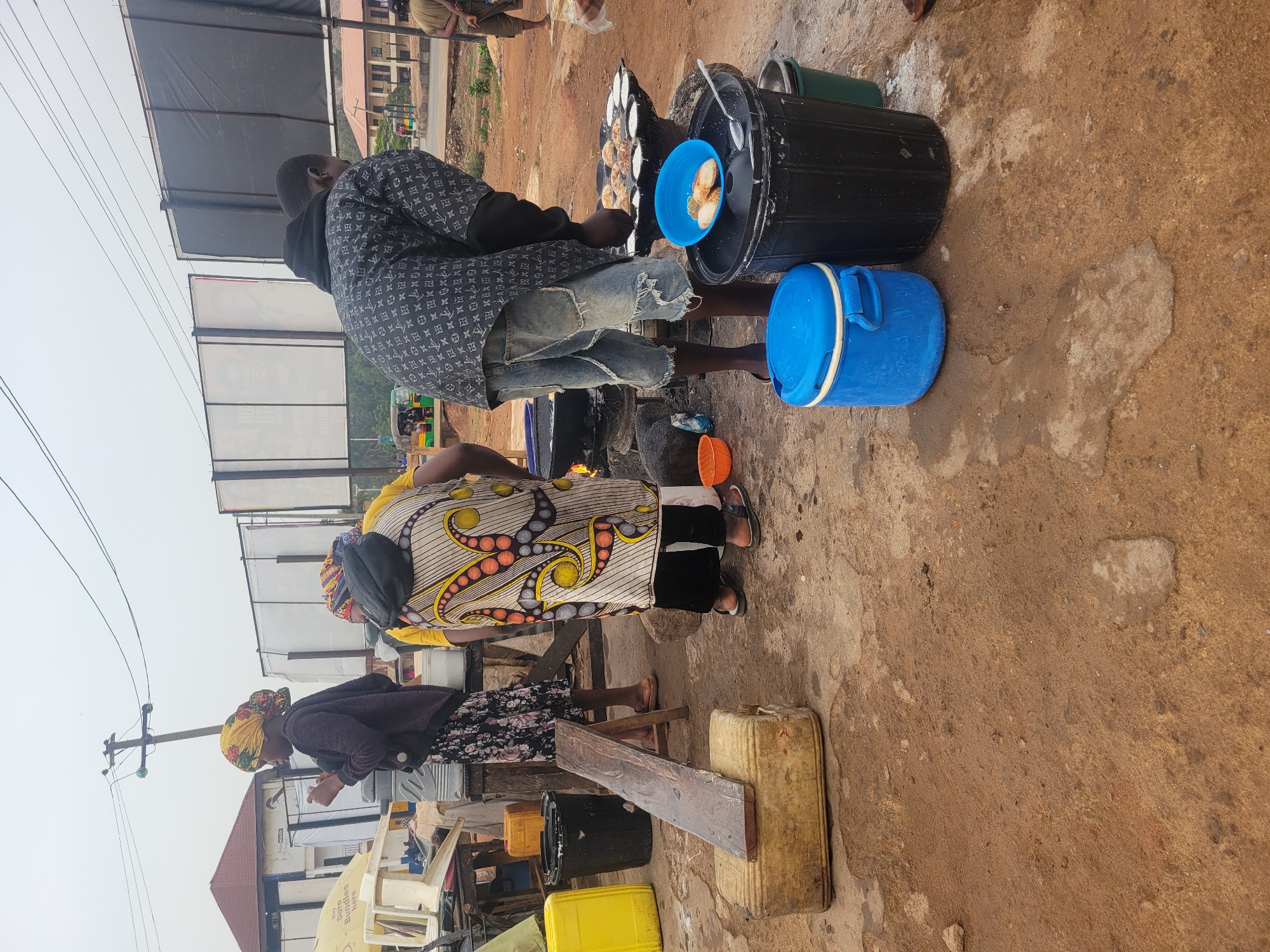 Morning street scene: outdoor cooking and pedestrian activity documented