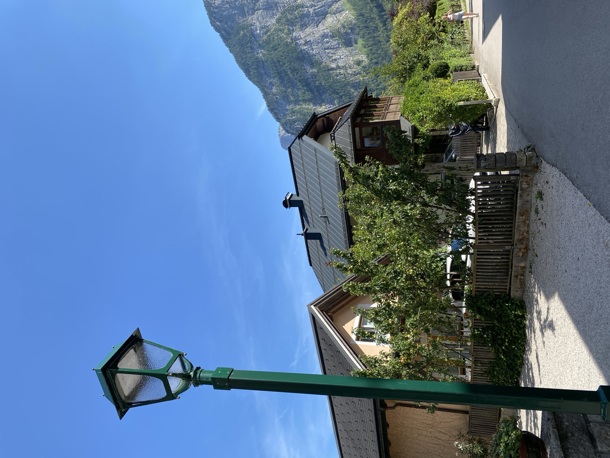 Street-level details from a quiet Hallstatt neighborhood on a summer afternoon
