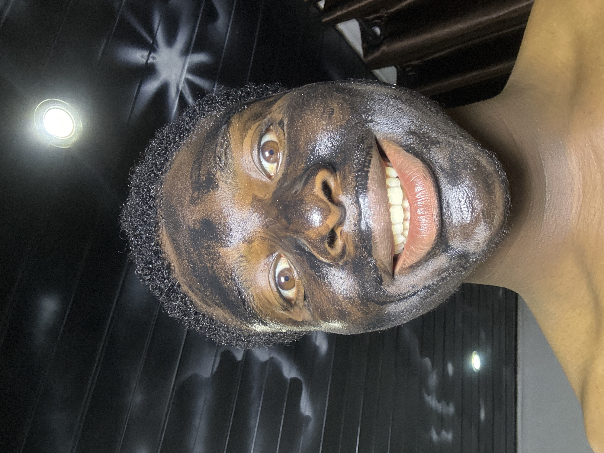 Person applies facial treatment in Bukuru, Nigeria
