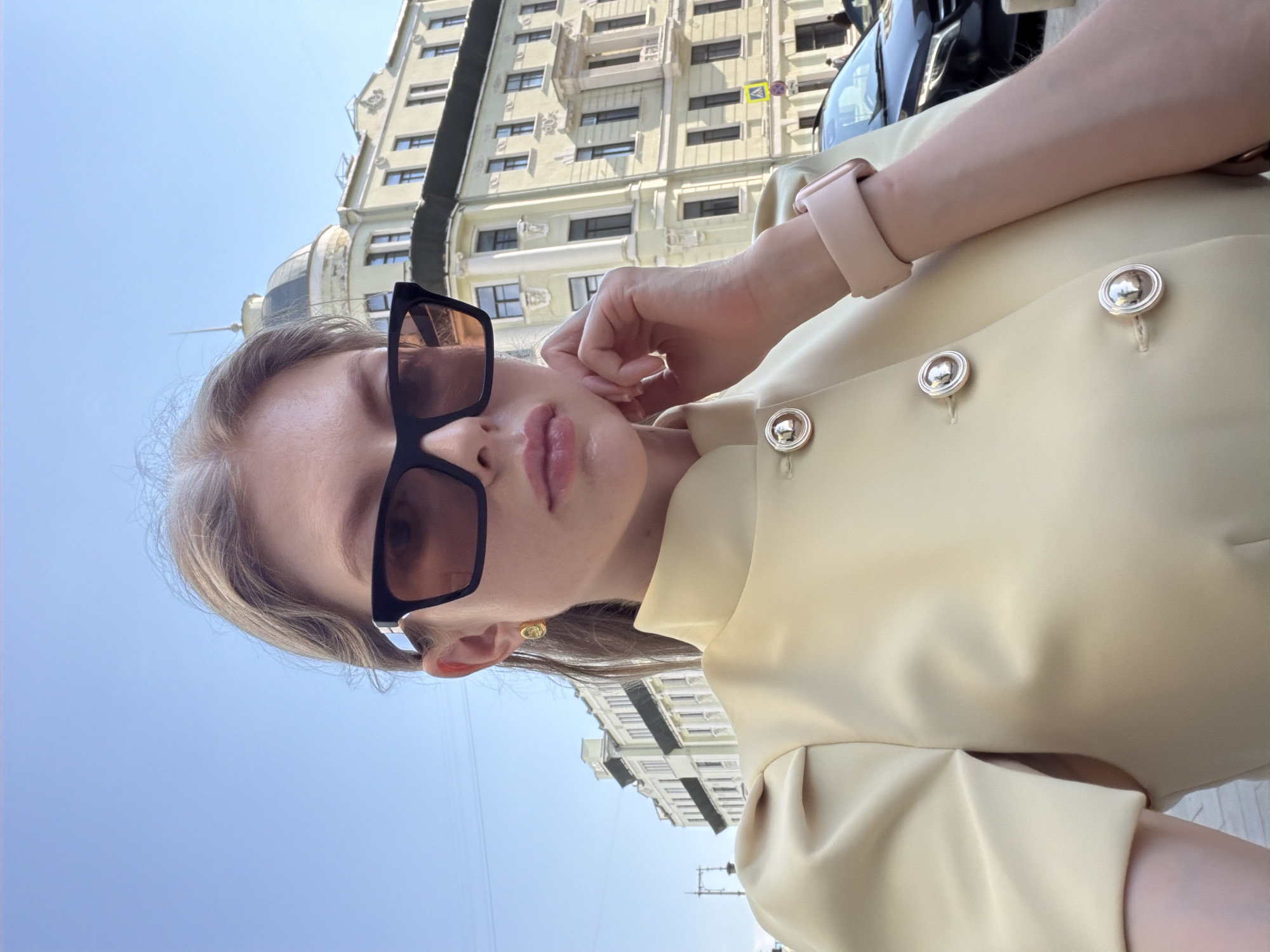 Woman photographed amid classical architecture in central Moscow