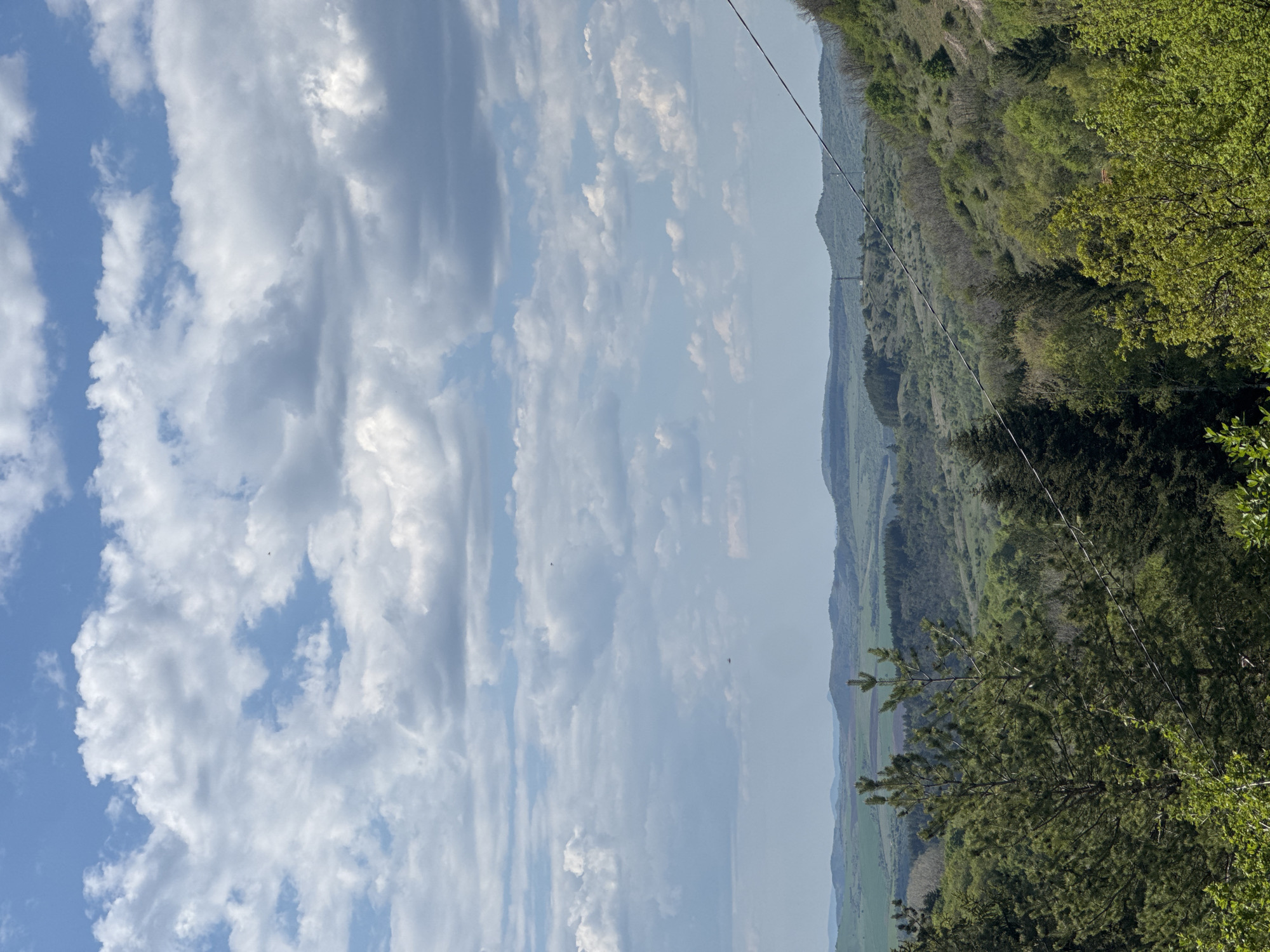 Observer documents cloud formations over Bulgarian countryside landscape