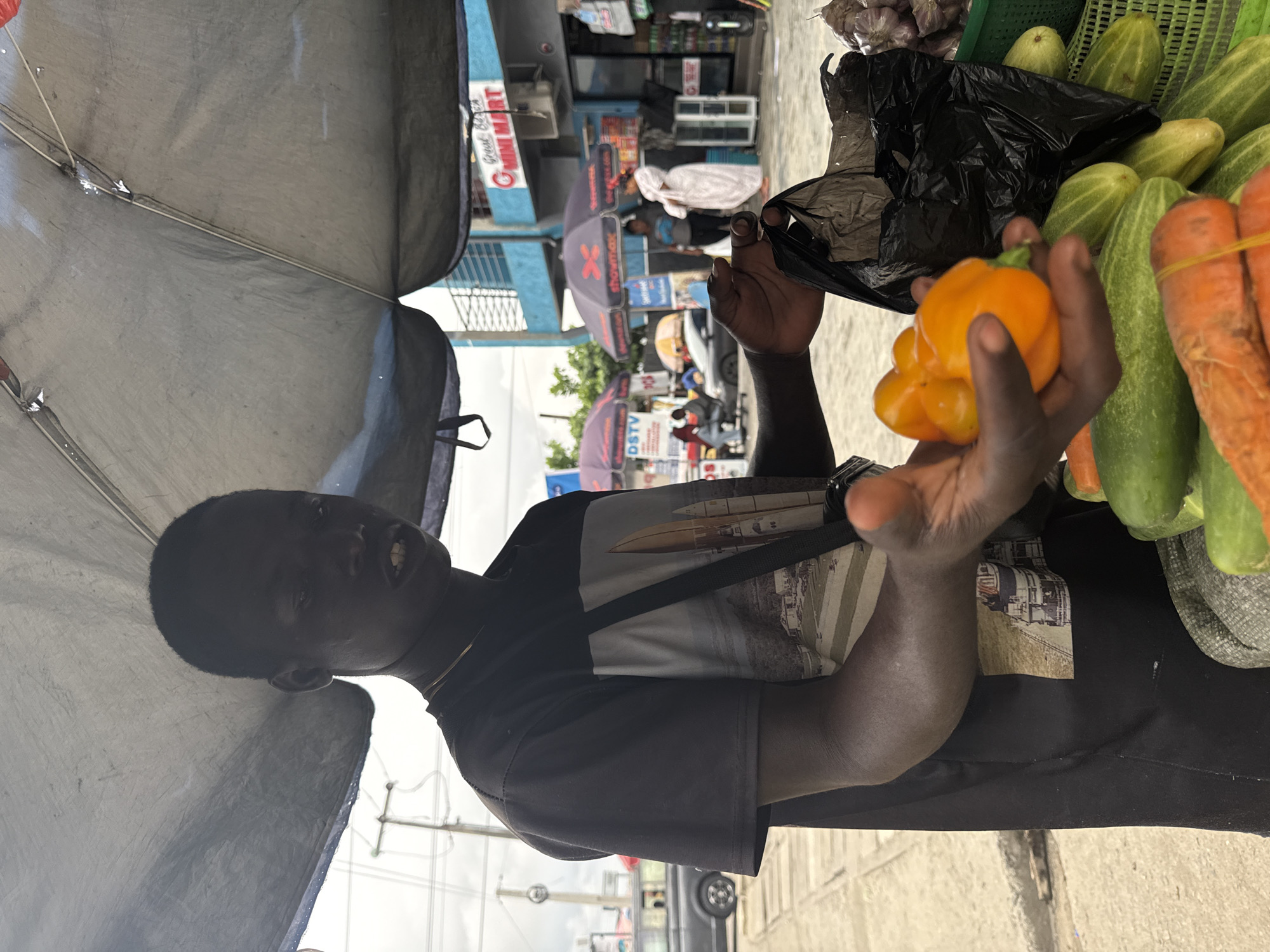Afternoon street life and market activity in Ado, Nigeria