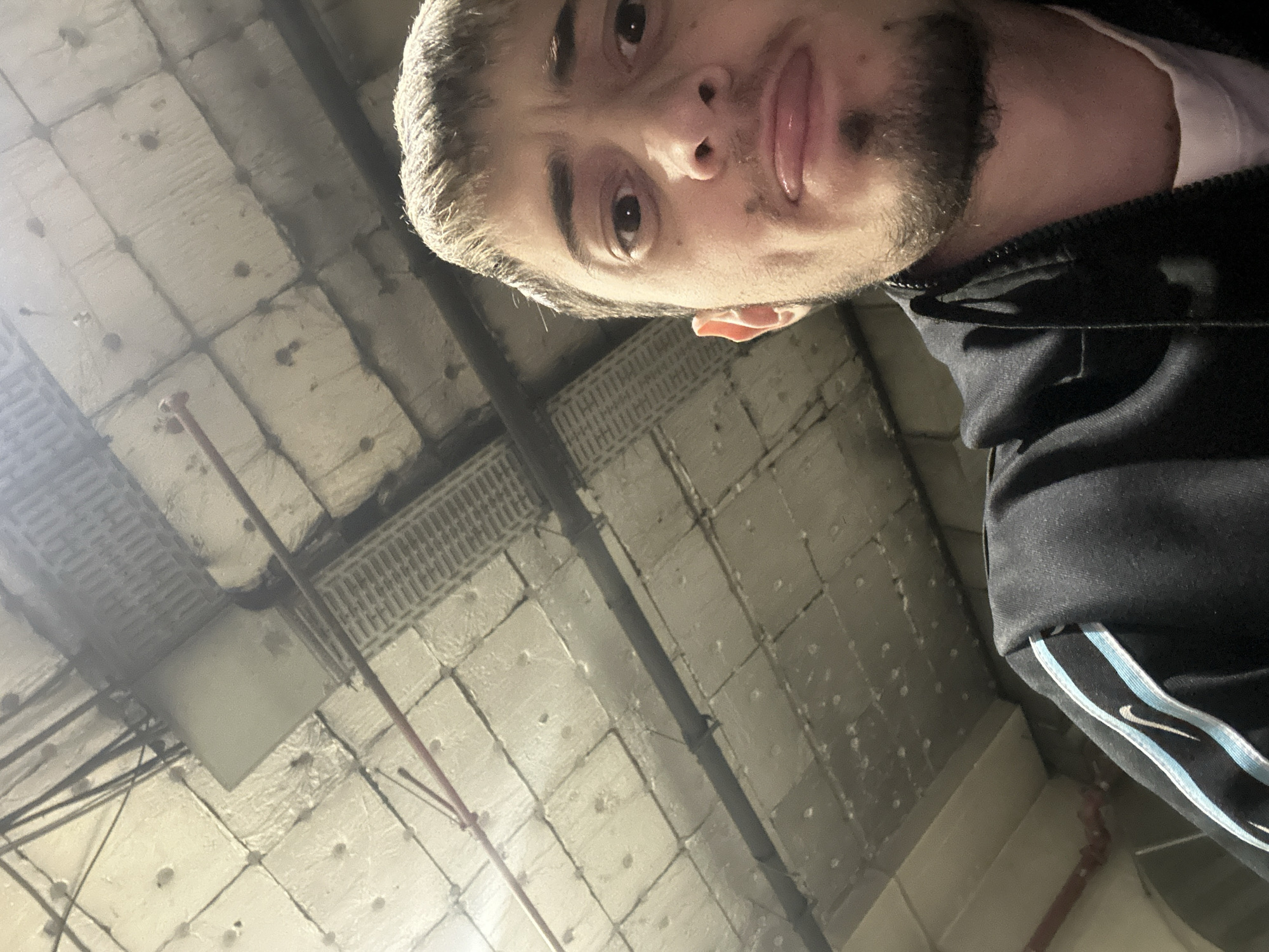 Man takes selfie in industrial indoor space in Bulgaria
