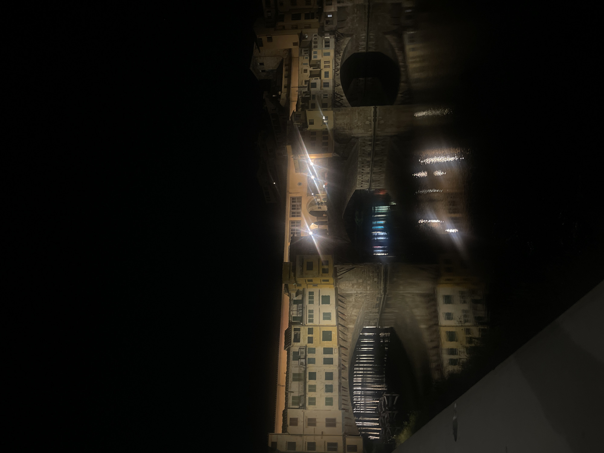 Ponte Vecchio bridge illuminated at night in Florence