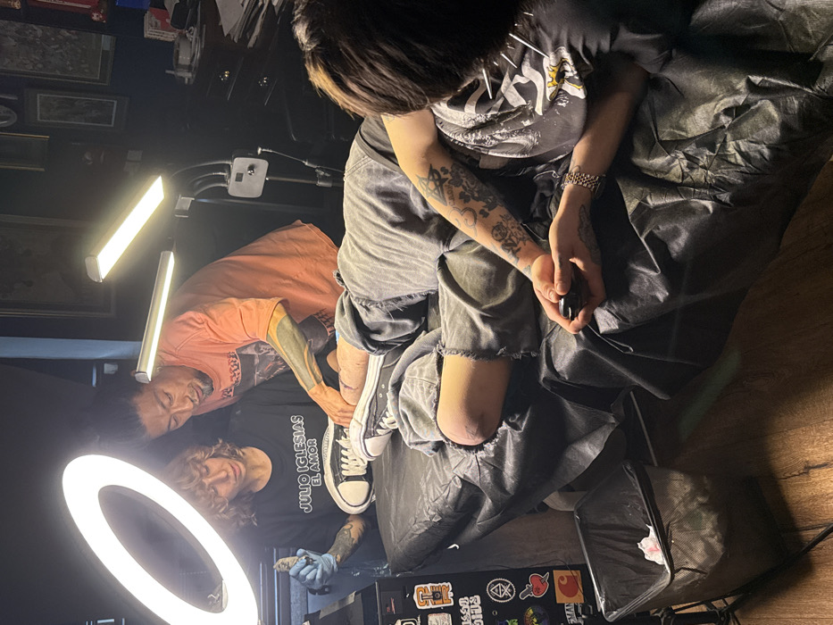 Early morning tattoo session documented in Tel Aviv studio