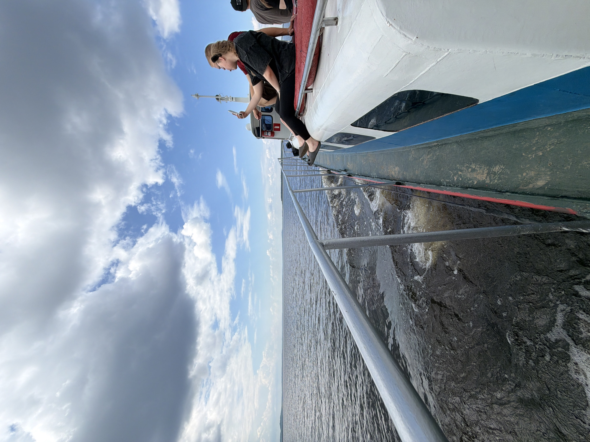 Boat ride across choppy Russian waters on a cloudy day
