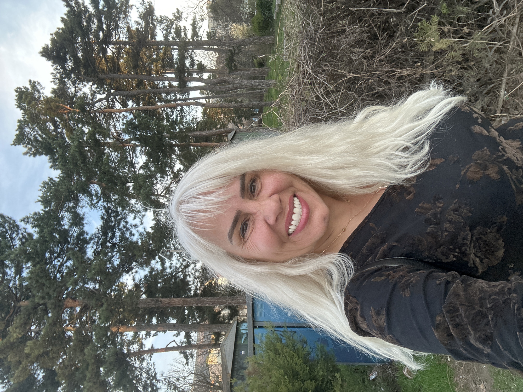 Woman photographed smiling in Sofia landscape setting