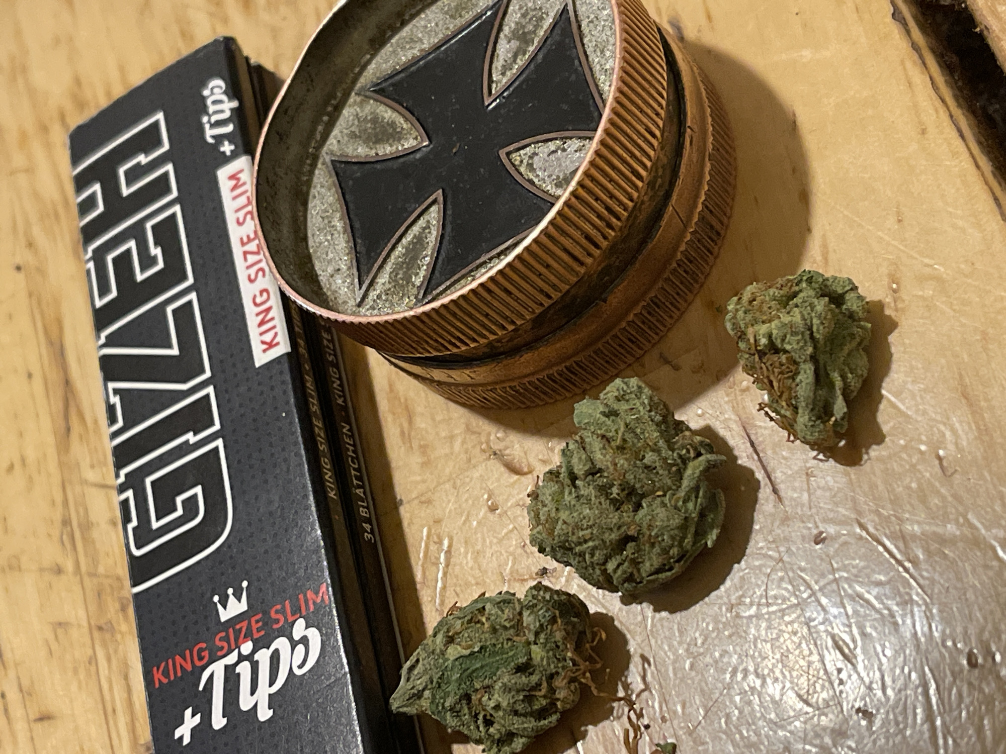 Cannabis preparation materials and young male documented indoors