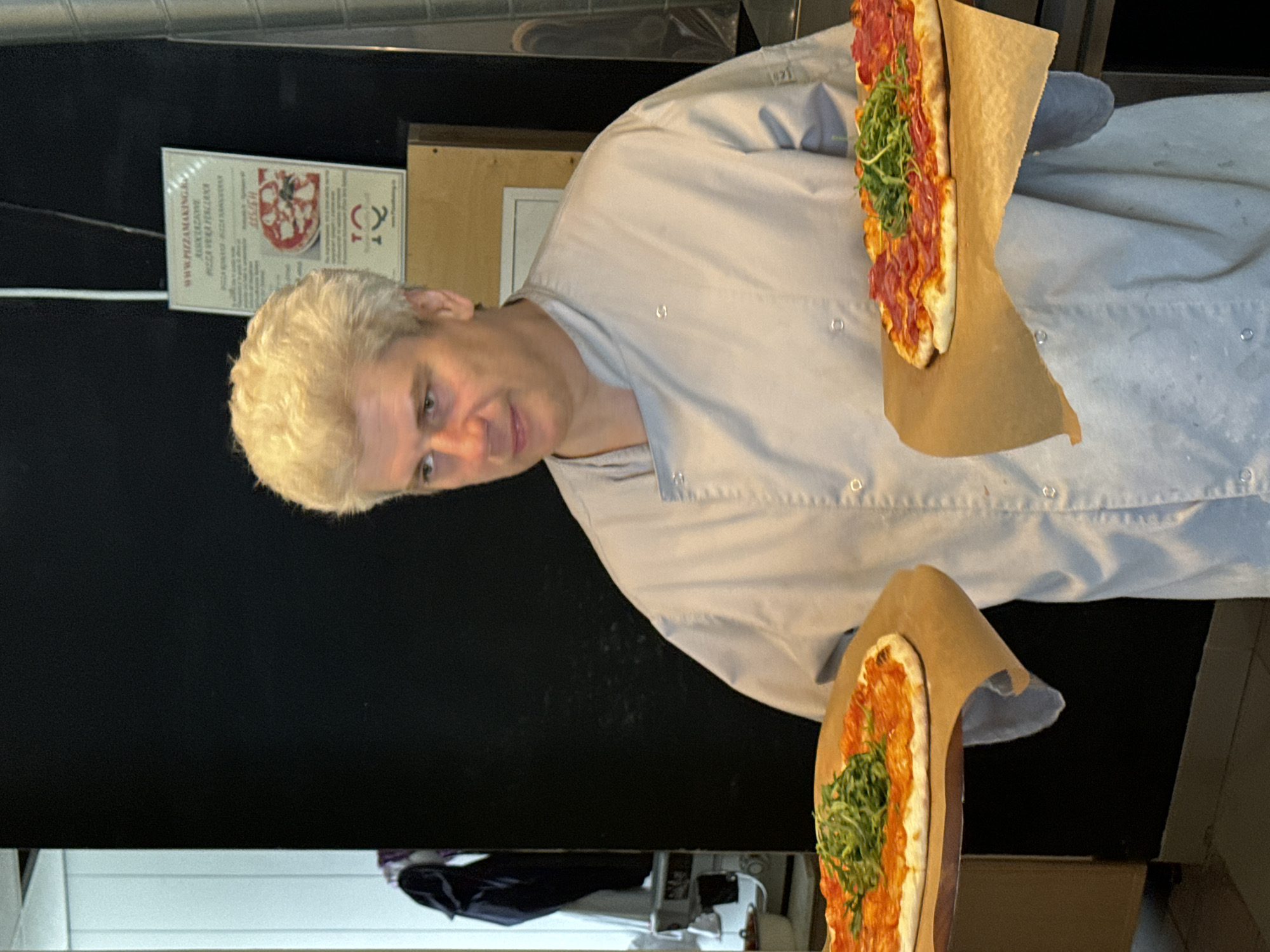 Chef prepares multiple pizzas at Saint Petersburg restaurant