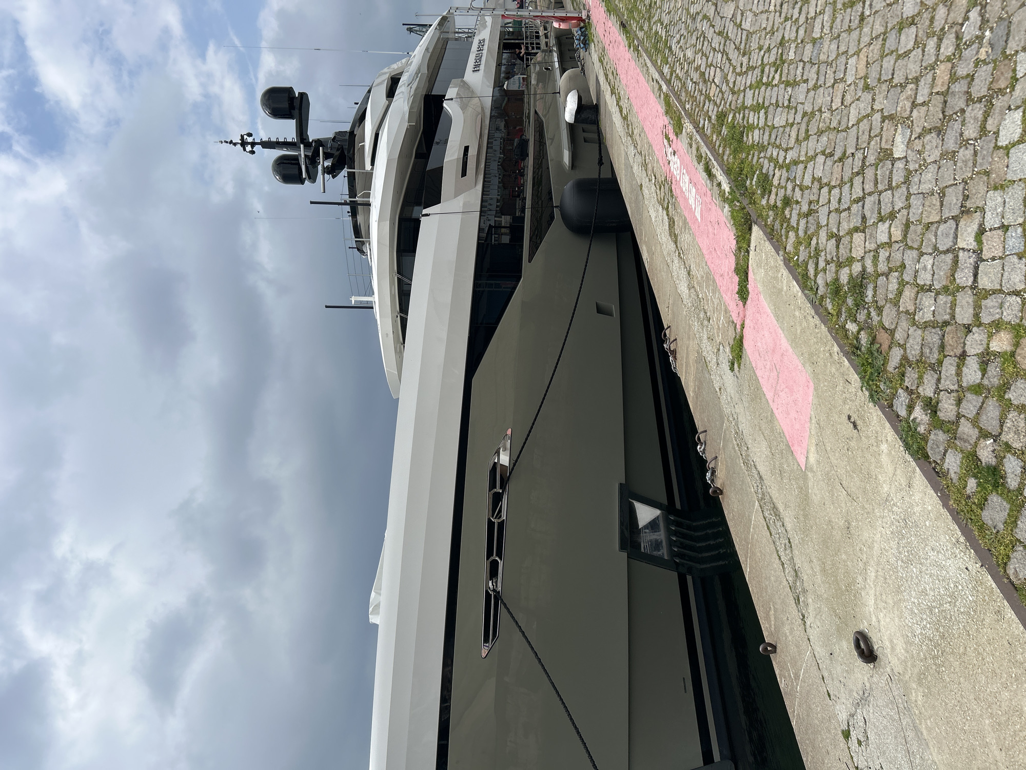 Coastal city port life observed during overcast morning hours