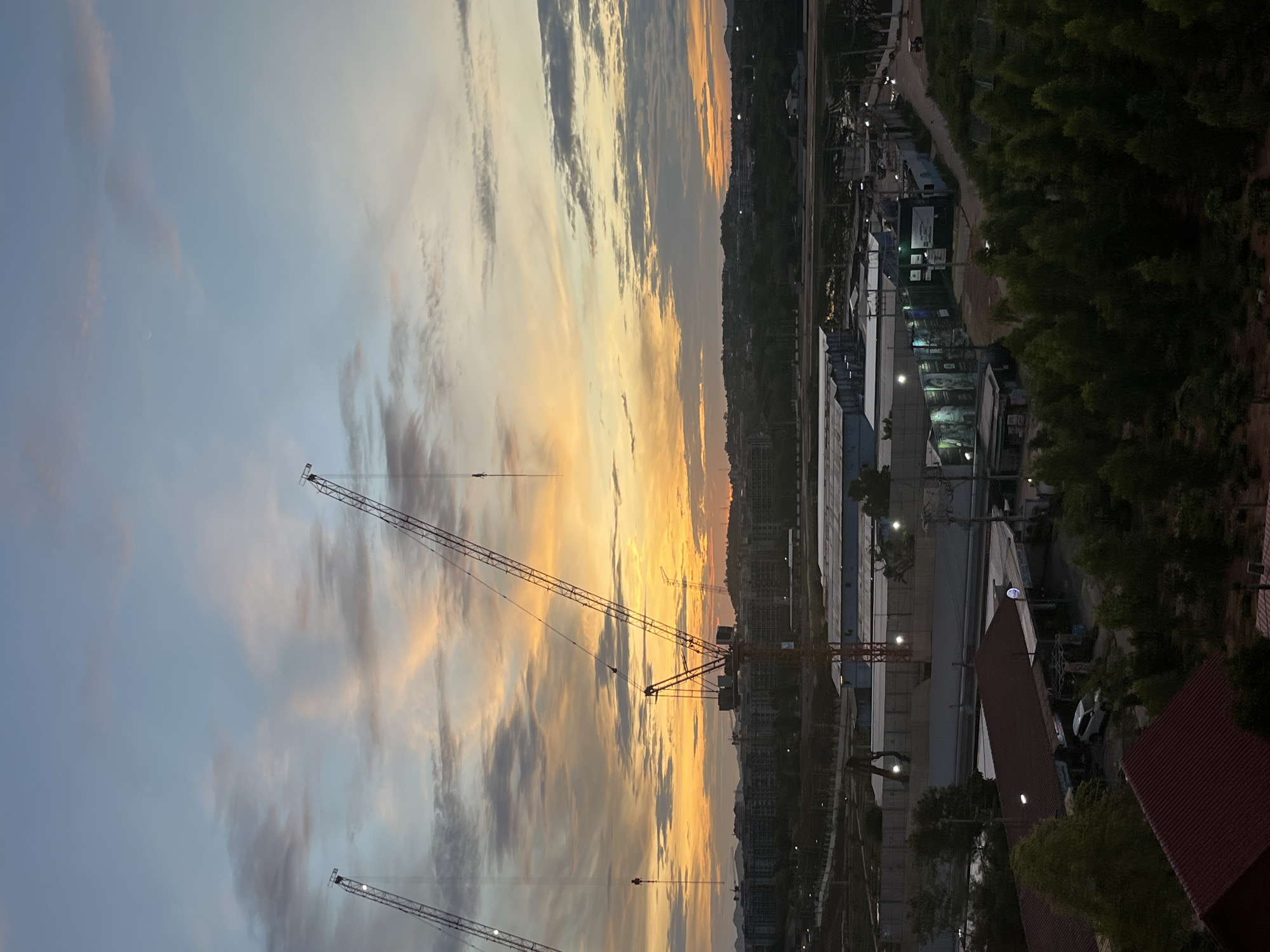 Construction cranes spotted during twilight in Pattaya City