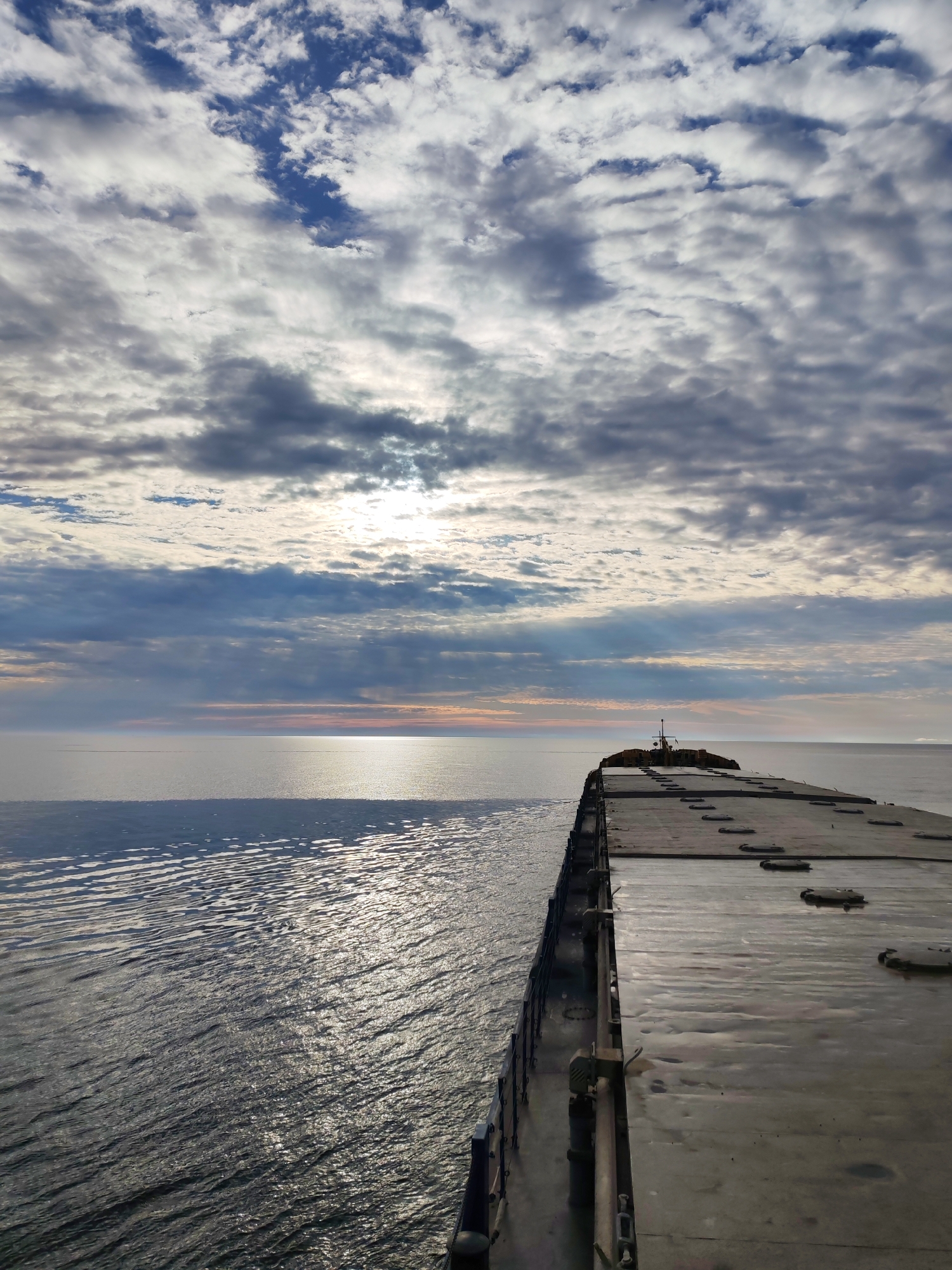 Bulk carrier at sea off the Russian coast under cloudy skies