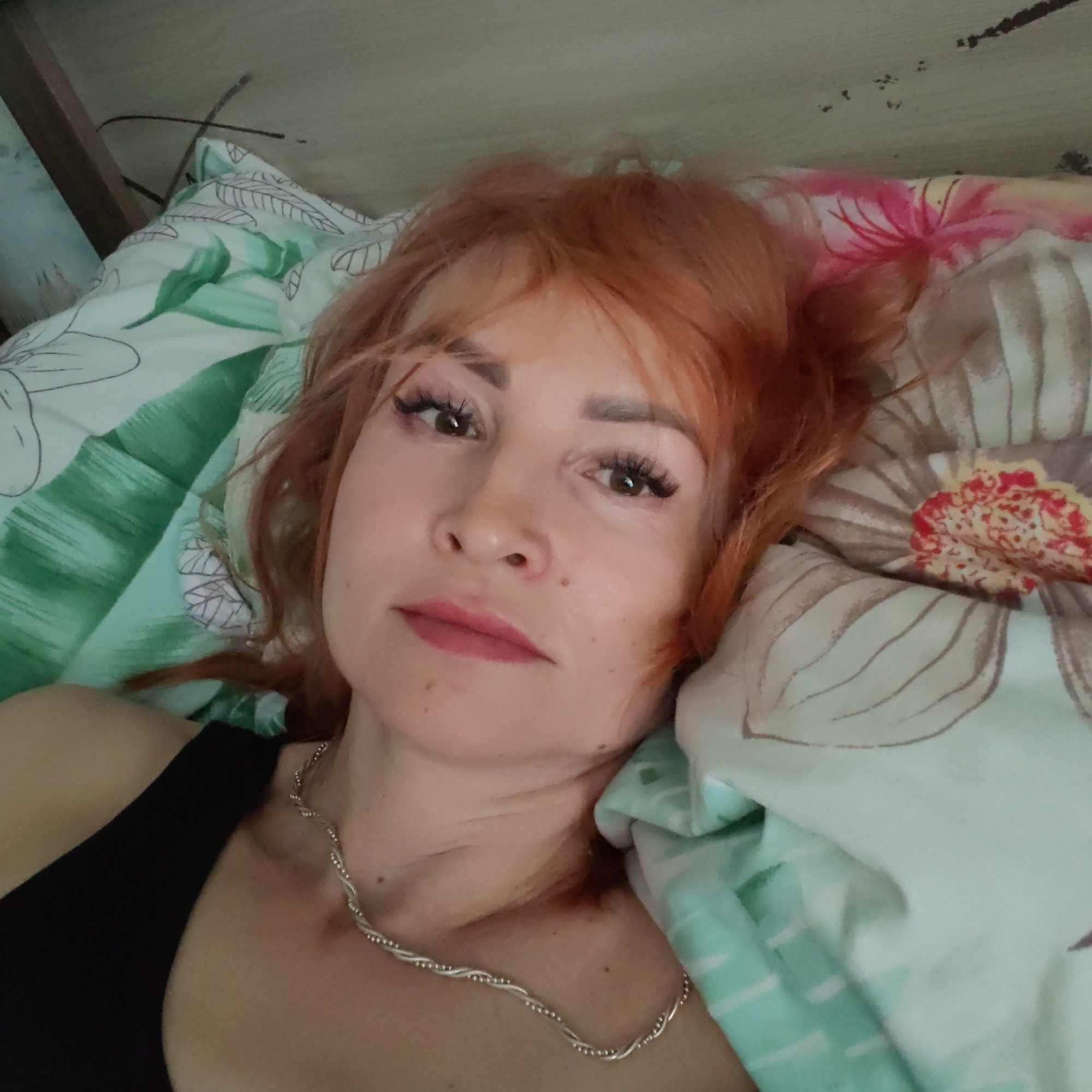 Woman and cats photographed in Chaikovsky home morning session