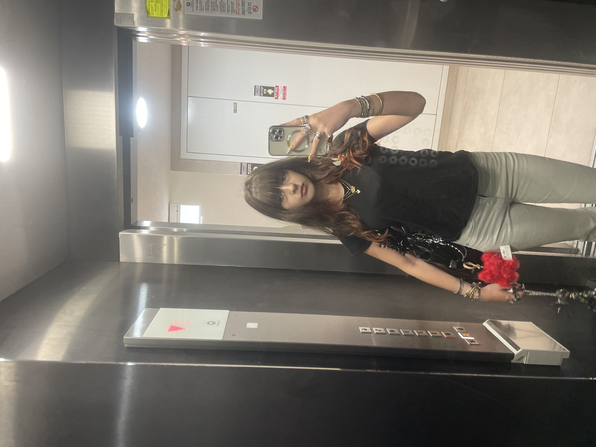 Woman takes morning selfies in Raanana elevator and outdoors