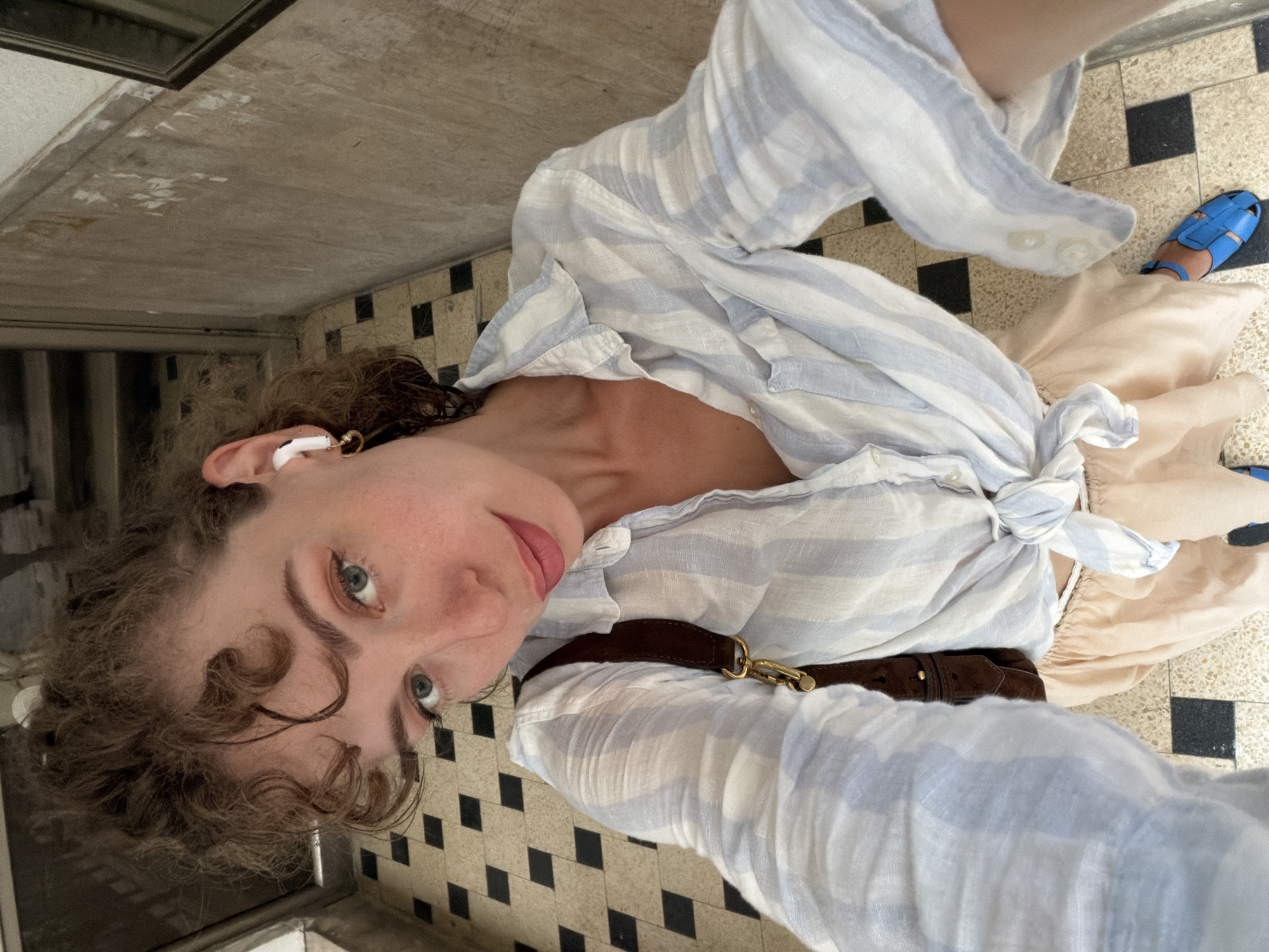 High-angle selfie on a checkerboard floor in Tel Aviv