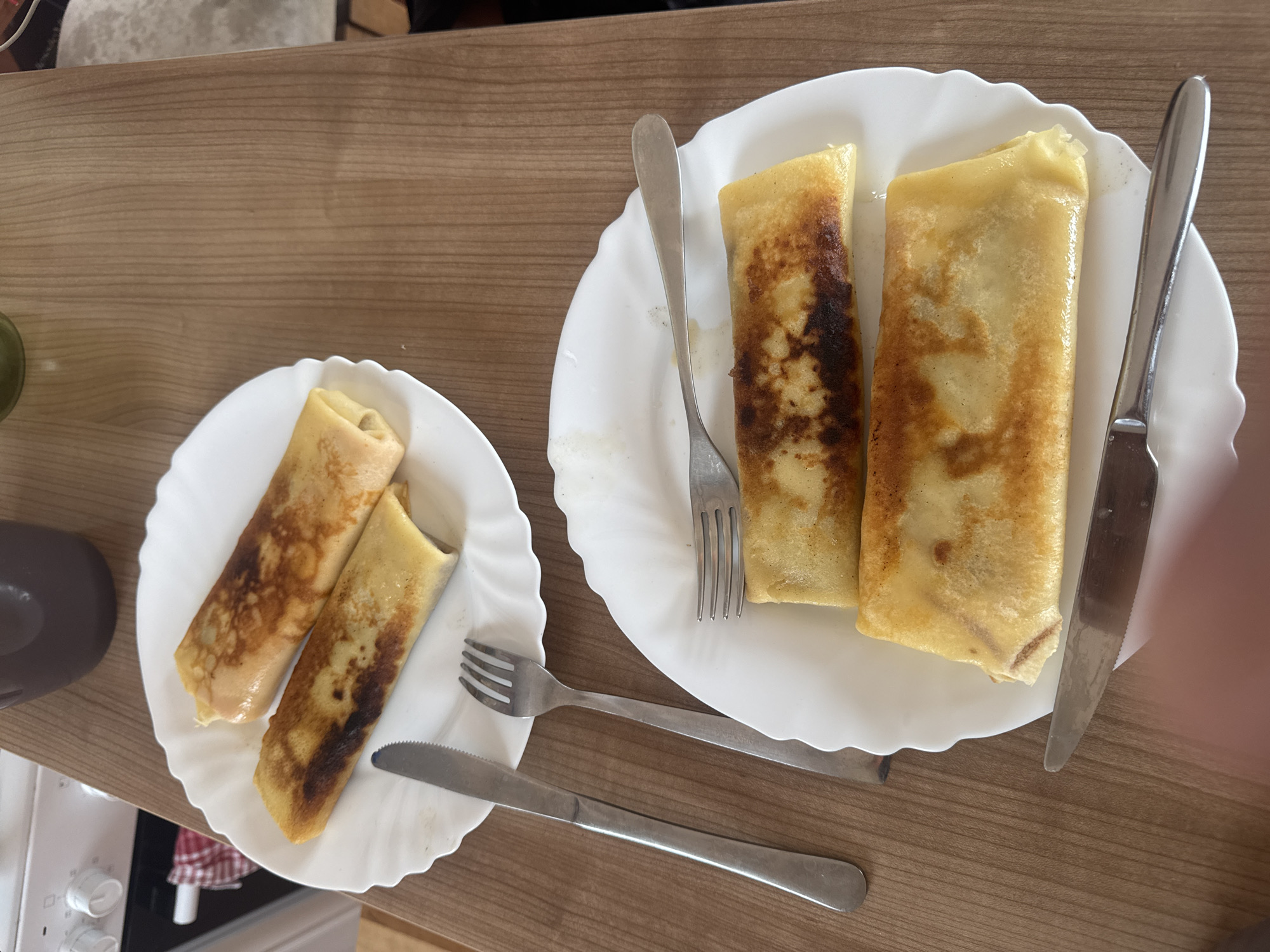 Morning crepes served on wooden table, witness documents breakfast