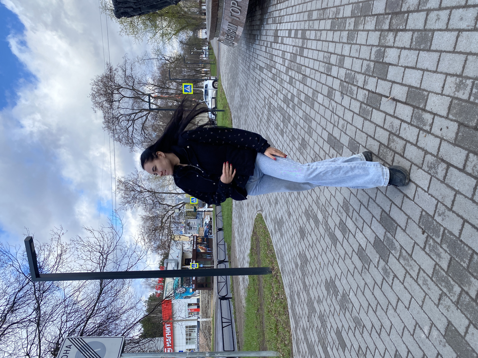 Young women photograph monument visit in Chaikovsky, Russia