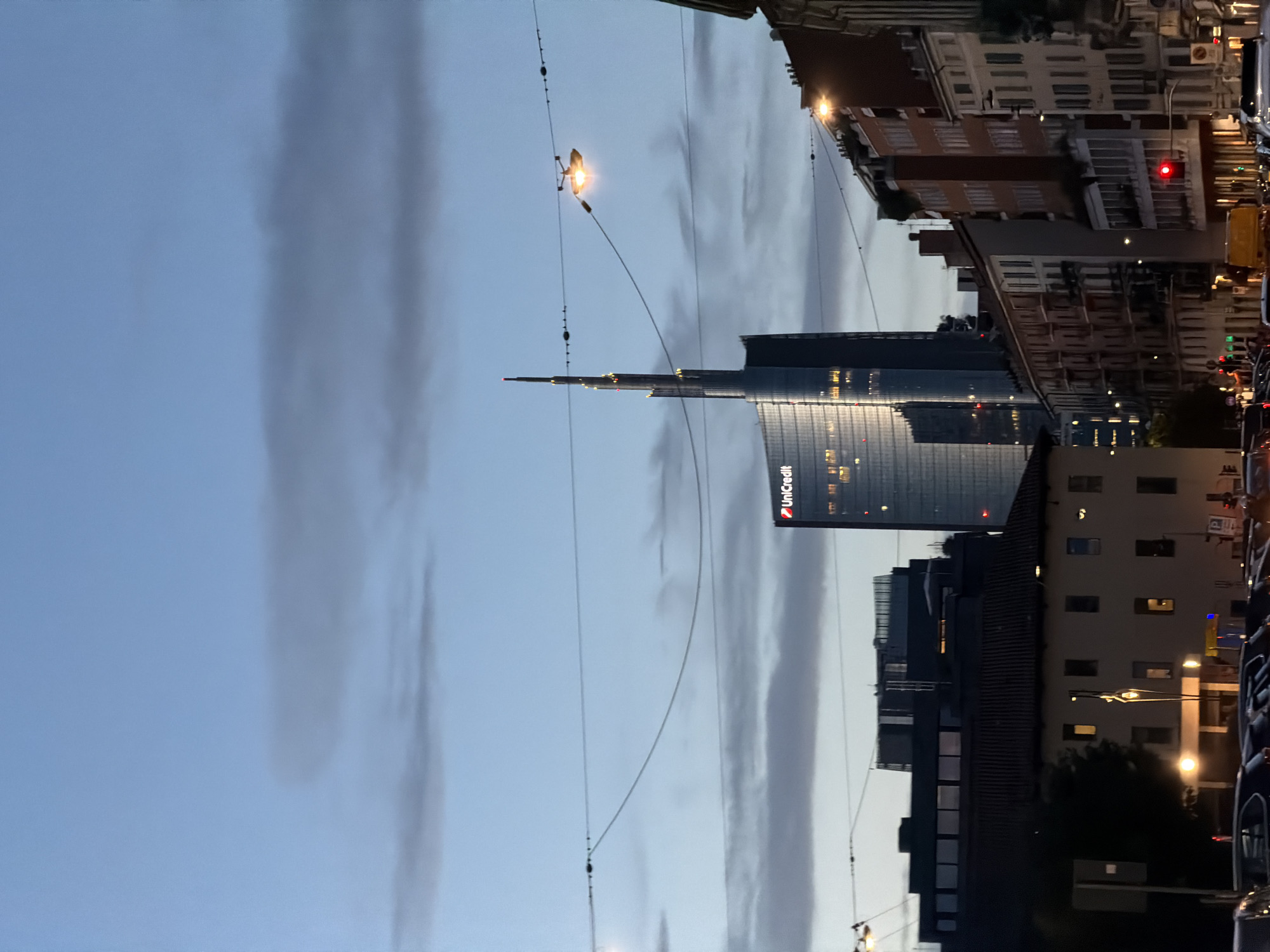 UniCredit Tower glows at dusk in Milan's Porta Nuova district