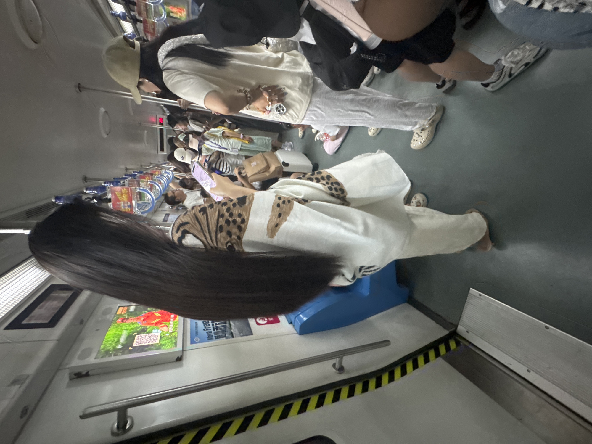Two angles on a subway commute, white shawl and leopard print