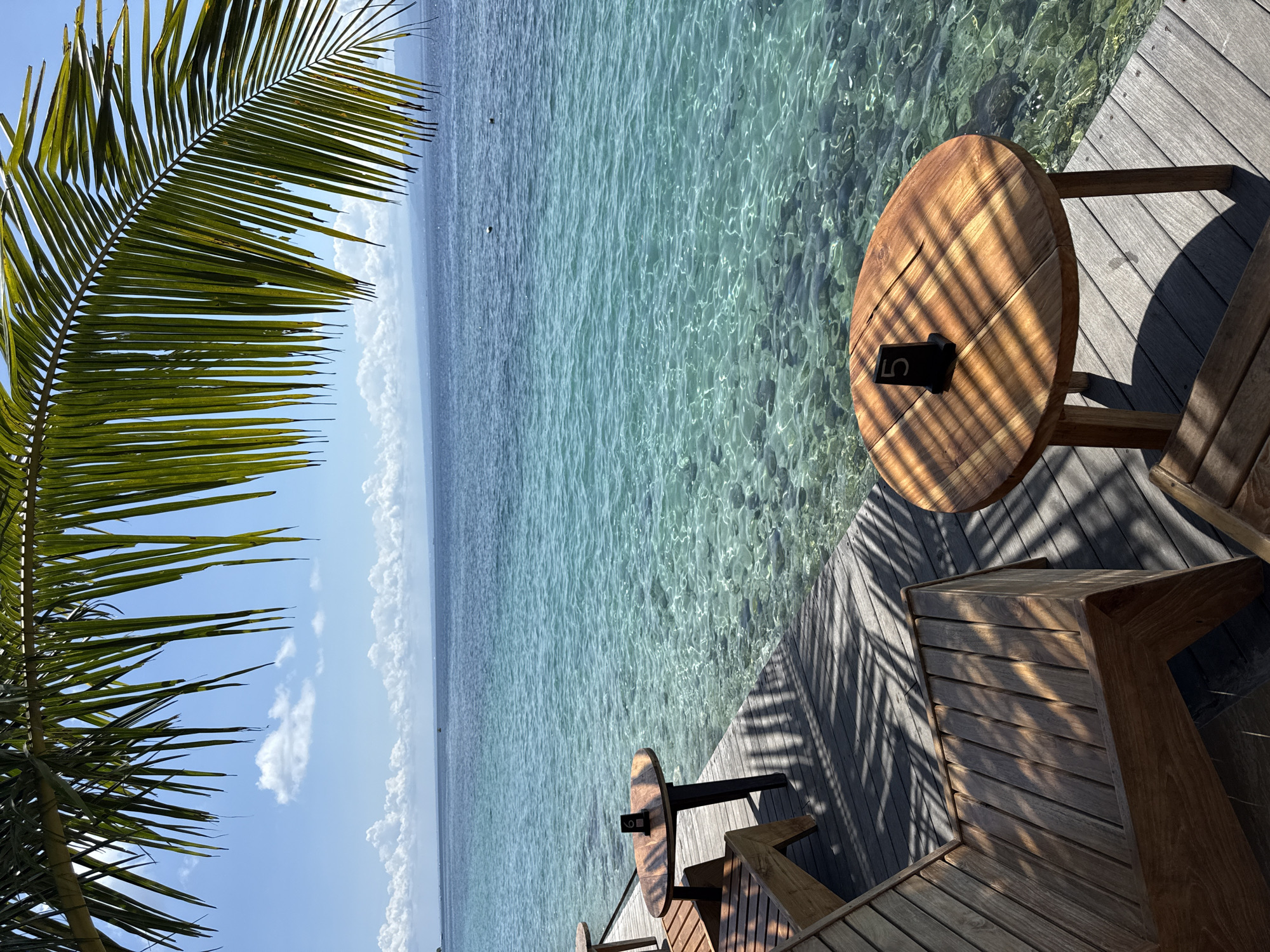 Morning relaxation on wooden deck at Nusa Penida waterfront