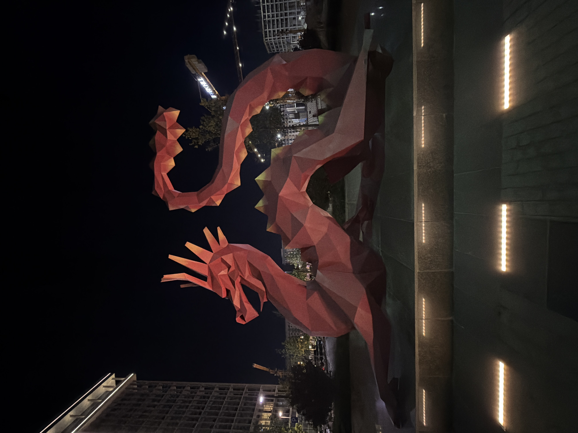 Lit public sculptures at night in Khatay Raion, Azerbaijan